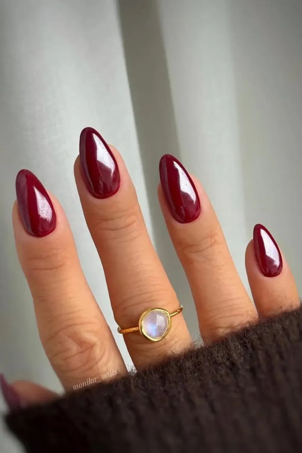Deep Merlot Almond Nails - Short almond-shaped nails painted in a rich, glossy, deep red (merlot/burgundy) polish.