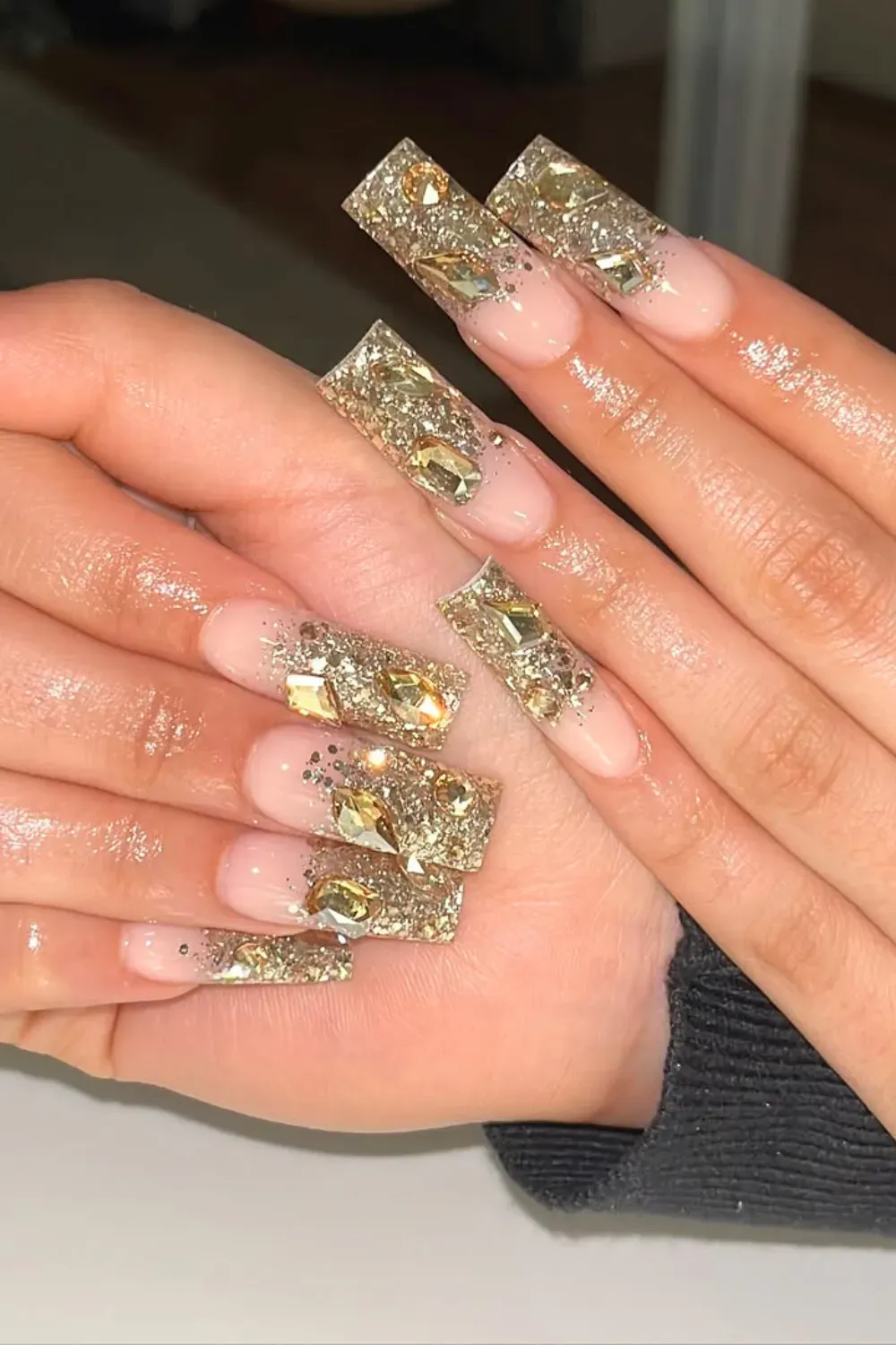 Almond nails with gold outline and starburst details