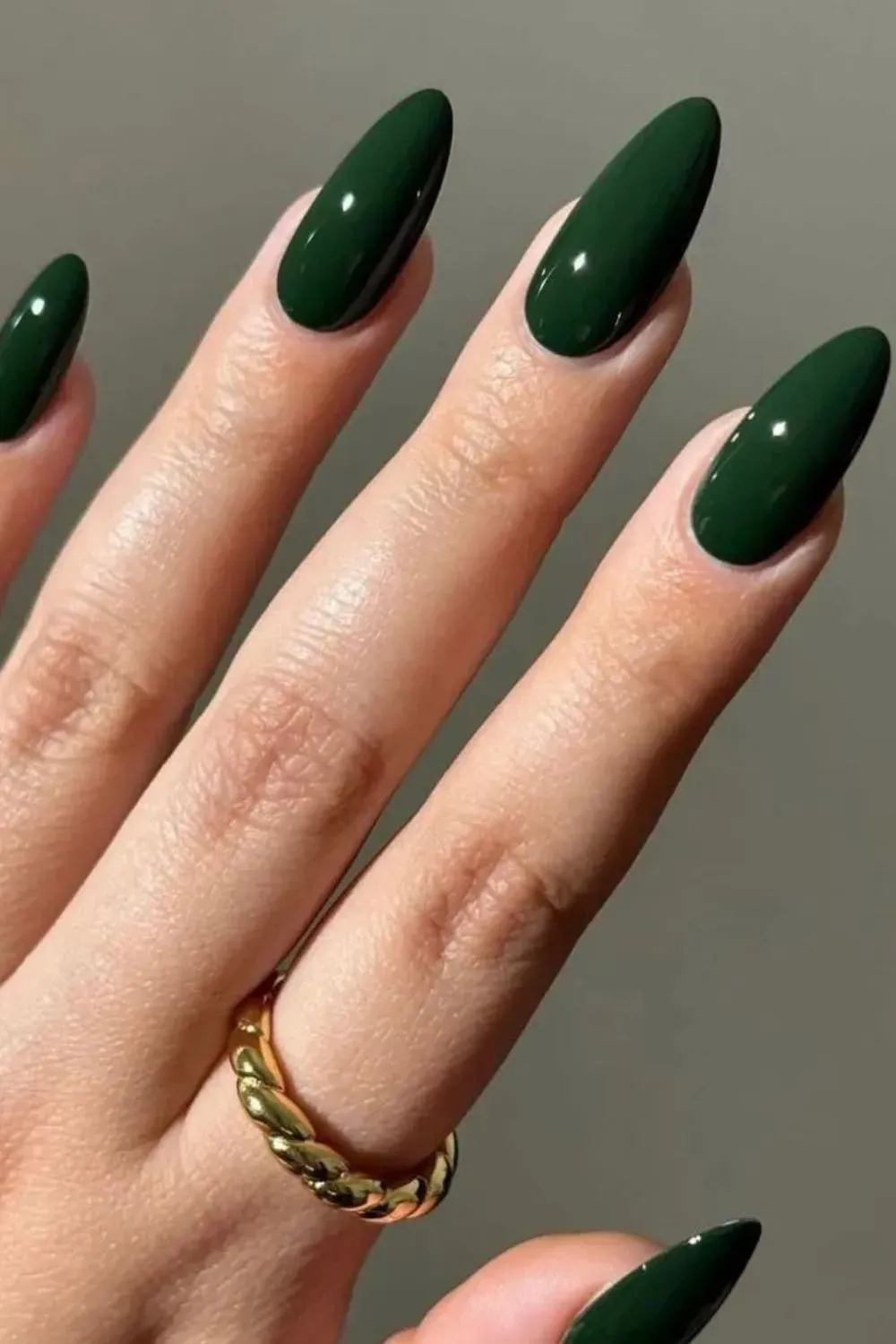 Emerald Green Glossy Nails - Long almond nails painted in deep emerald green with a high-shine finish