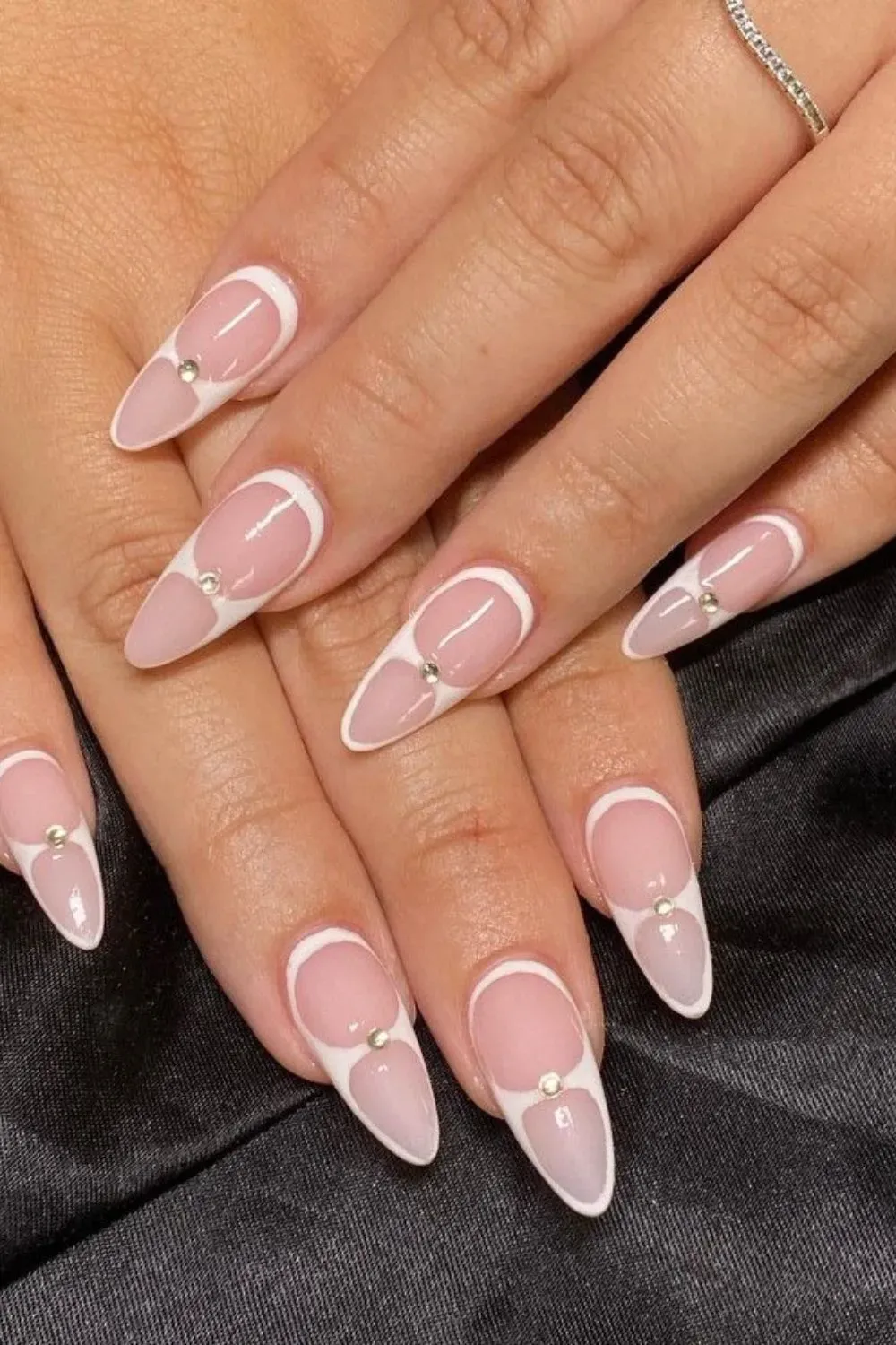 White Framed French Manicure with Gems - Almond nails with outlined French tips and rhinestone accents