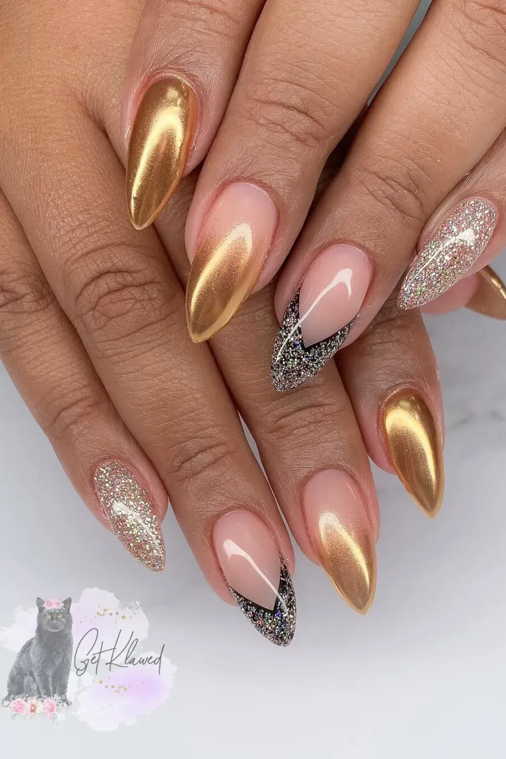 Stiletto nails with gold chrome accent.