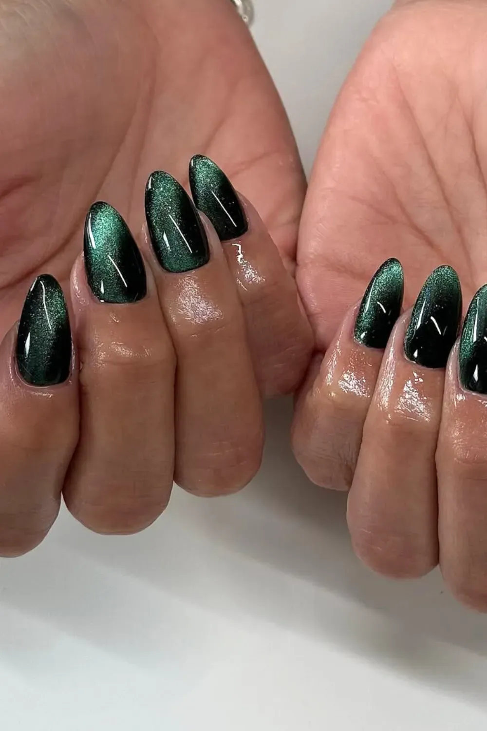 Green Cat Eye: Deep emerald or moss green magnetic polish with a shifting, multi-dimensional effect that adds drama and shimmer.