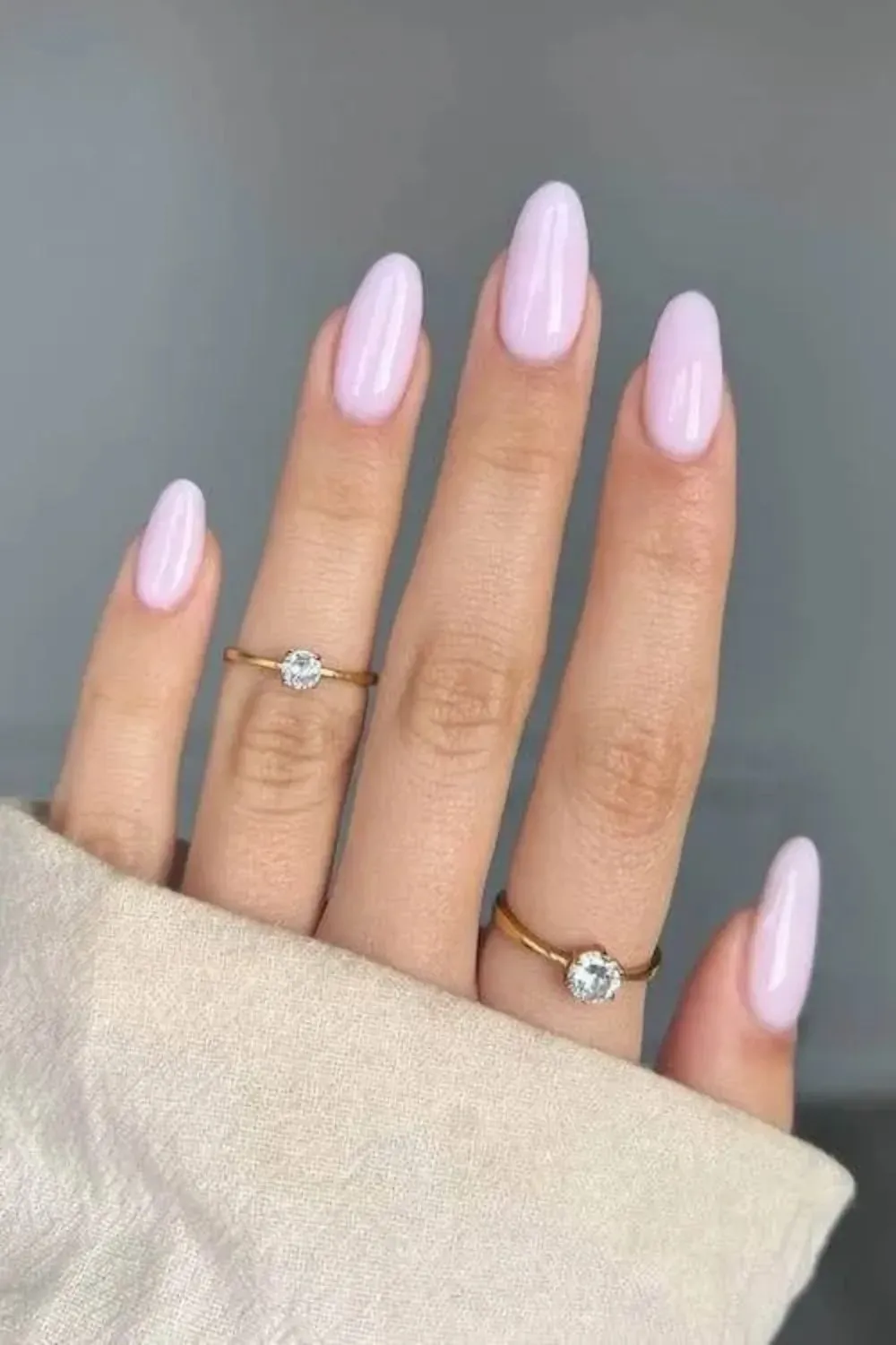 Lilac Pink Glossy Almond Nails - Pale lilac pink glossy nails with a minimalist finish