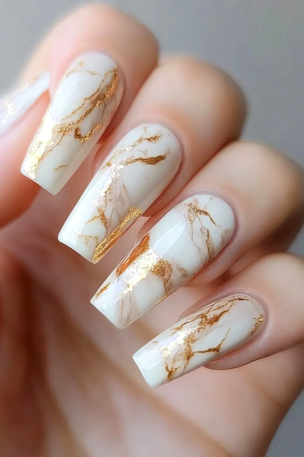 Marble coffin nails with gold foil accents.