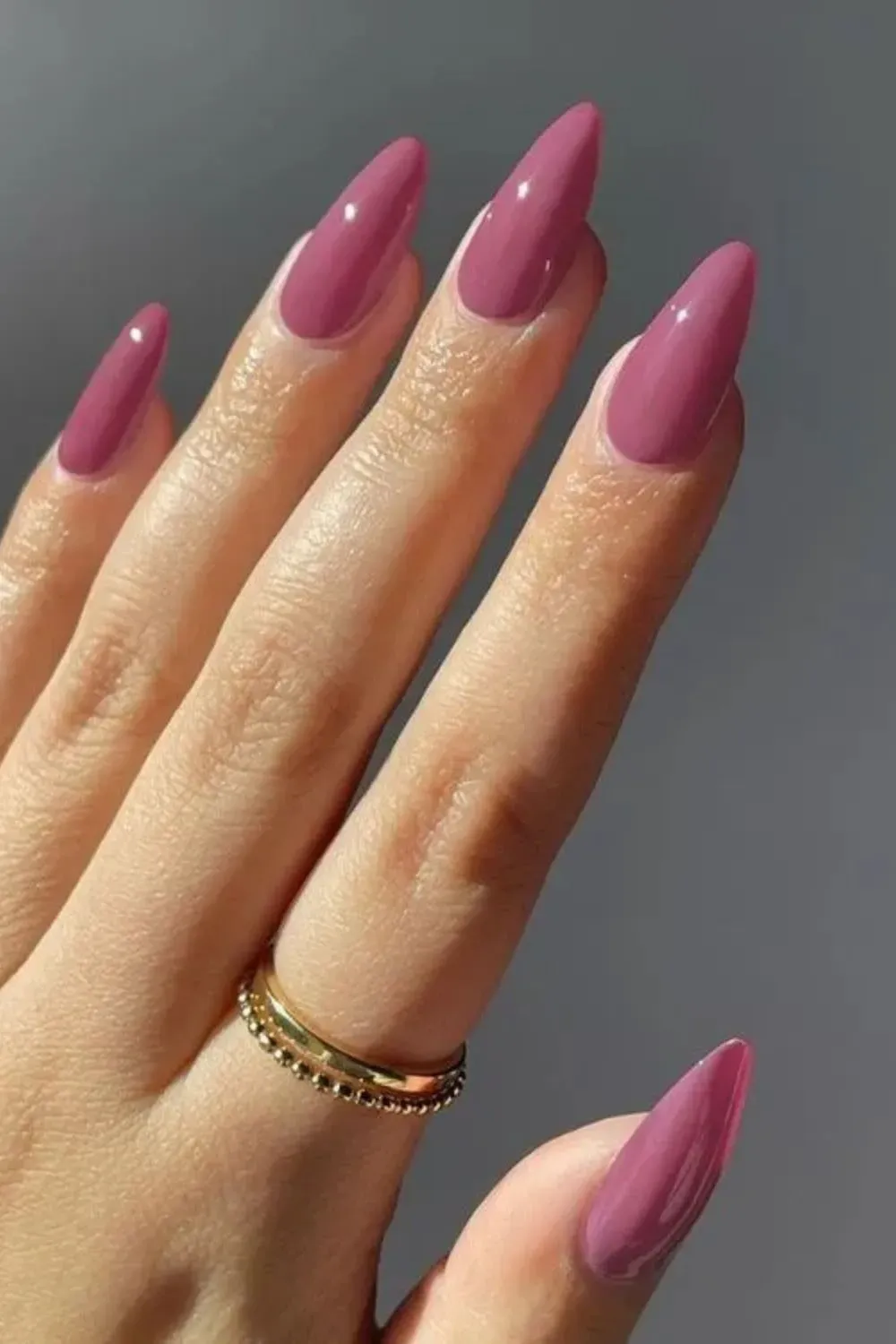 Dark Mauve Glossy Stiletto Nails - Sharp stiletto nails in glossy dark mauve for a dramatic spring look
