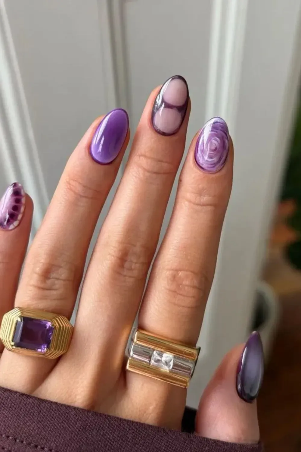 Purple Swirl Nail Art - Artistic purple nails with swirls, textures, and marbled effects