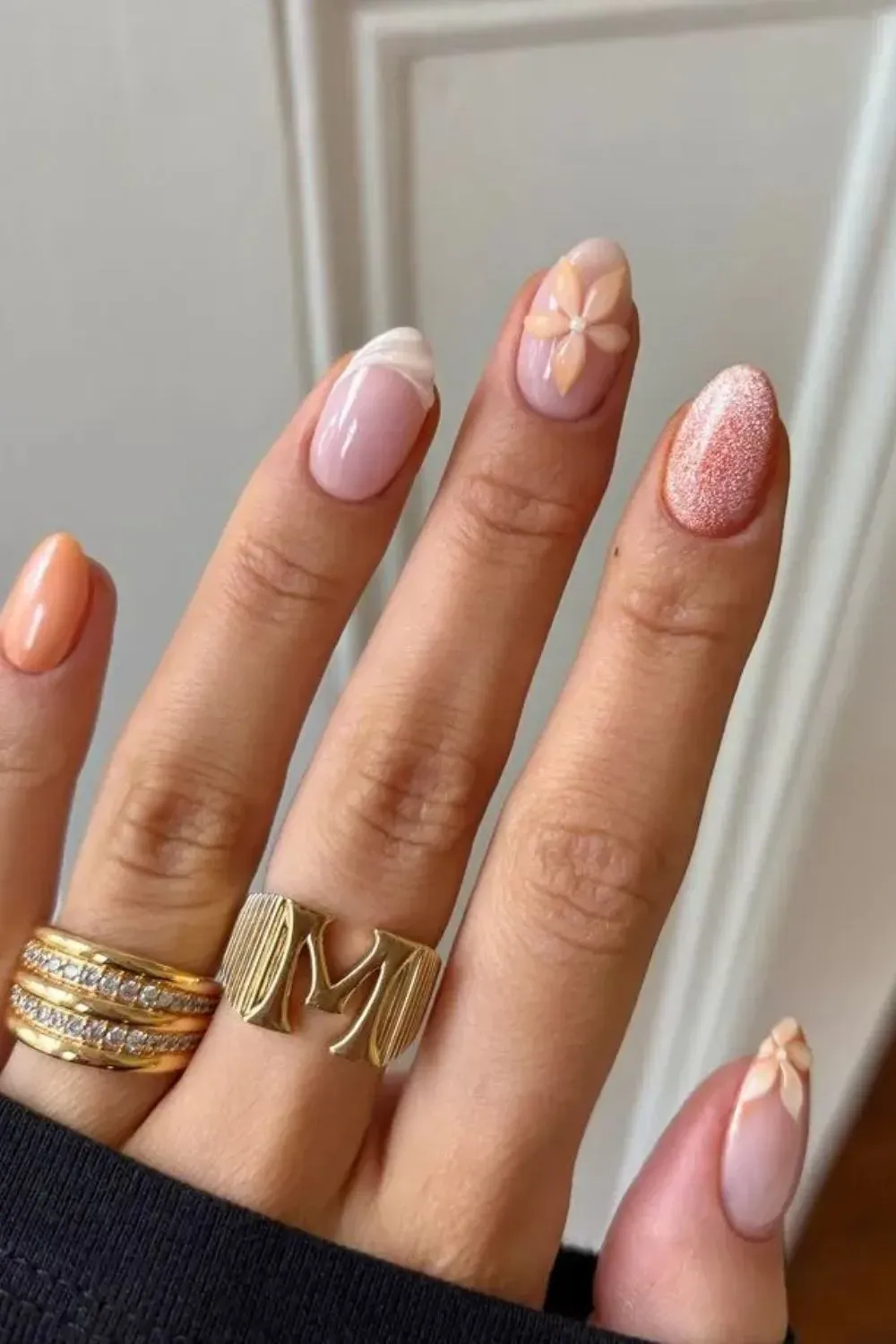 Peach Sorbet Nails with 3D Flowers - Multi-styled nails featuring peach polish, florals, and glitter accents