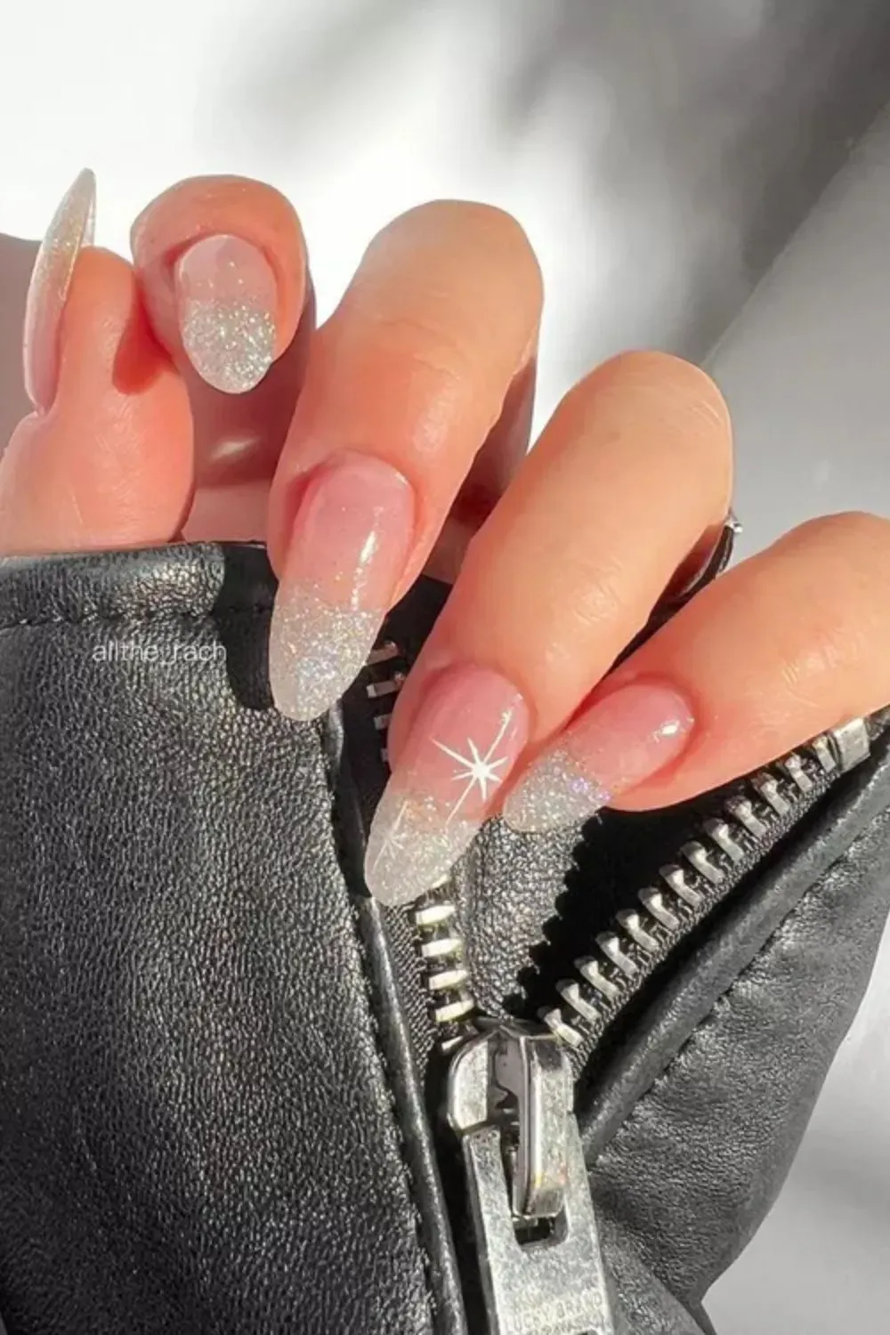 White Glitter Fade Tips - Almond nails with clear base and sparkling glittery white ombré tips