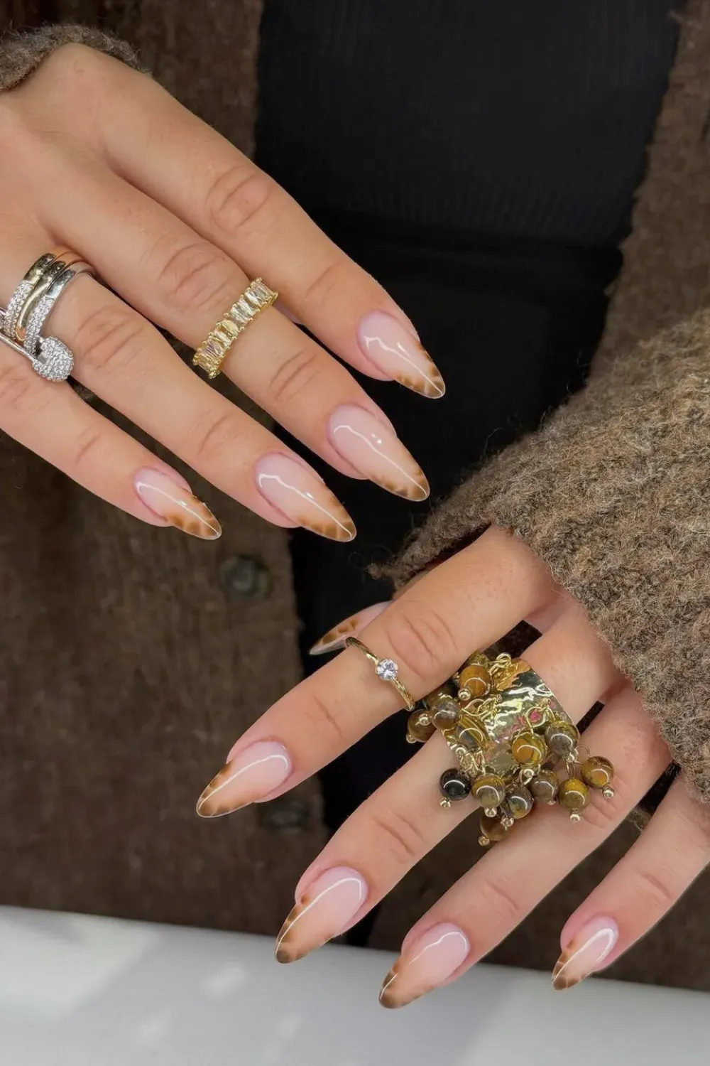 Brown Ombre Almond French: Elegant almond nails with a beautifully blended brown ombre French tip
