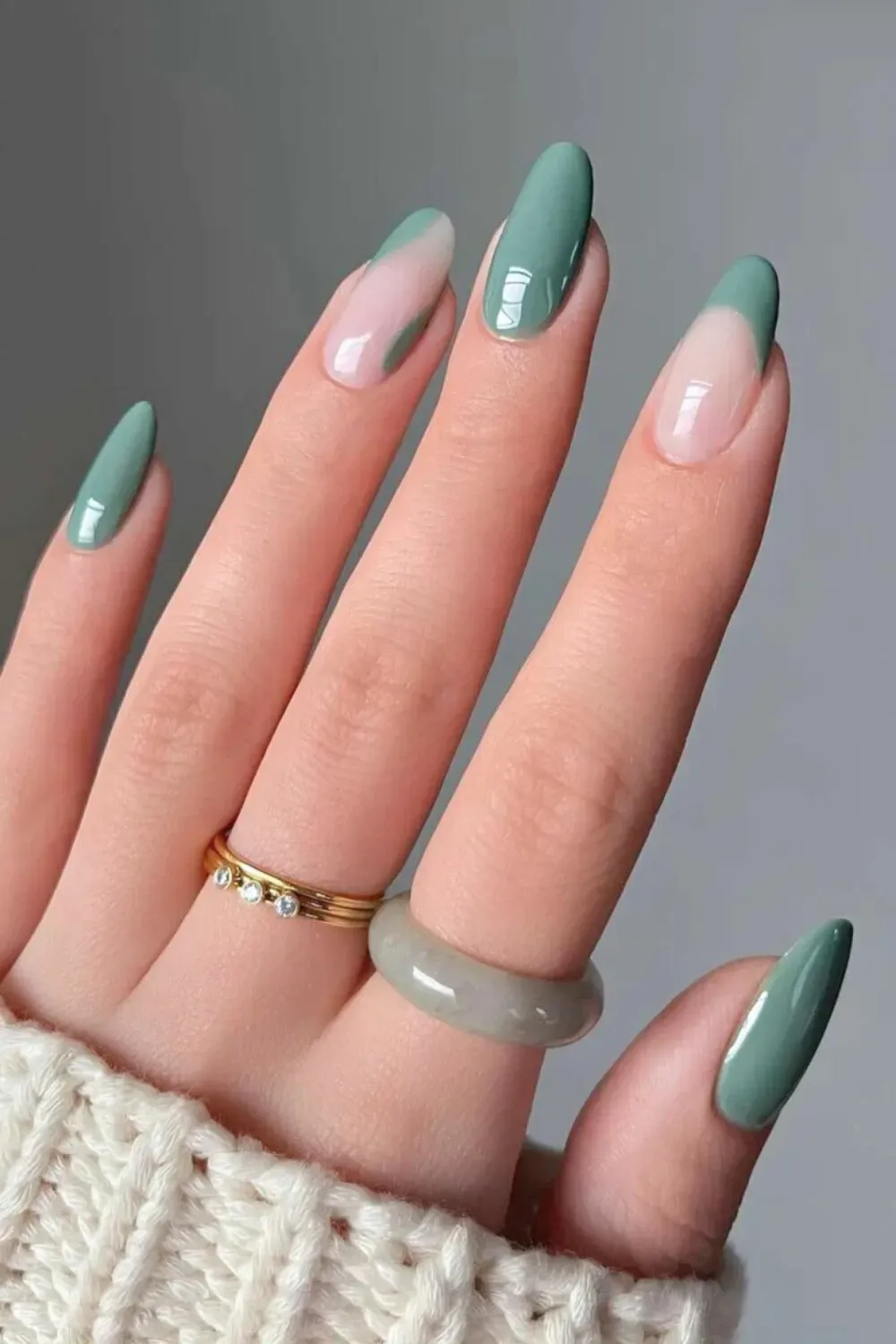 Pastel Sage French Tip Negative Space Almond - Long almond nails with a sweeping sage green French tip design and prominent negative space.