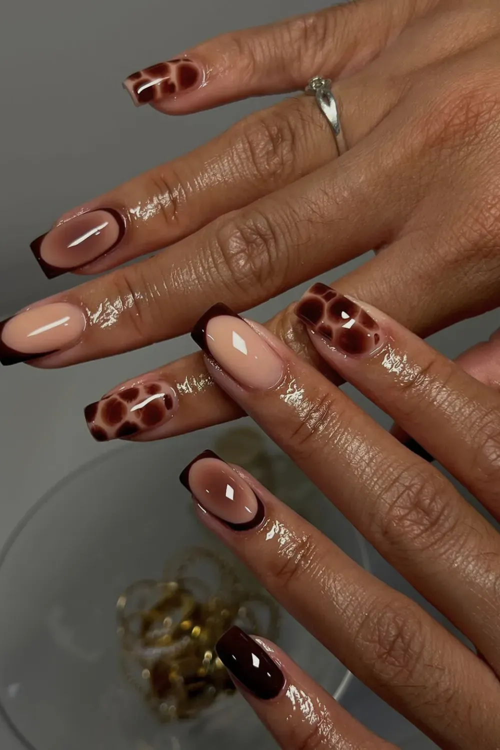 Tortoise Shell Square French Alt Text: Square nails with brown and tortoise shell print french tips.