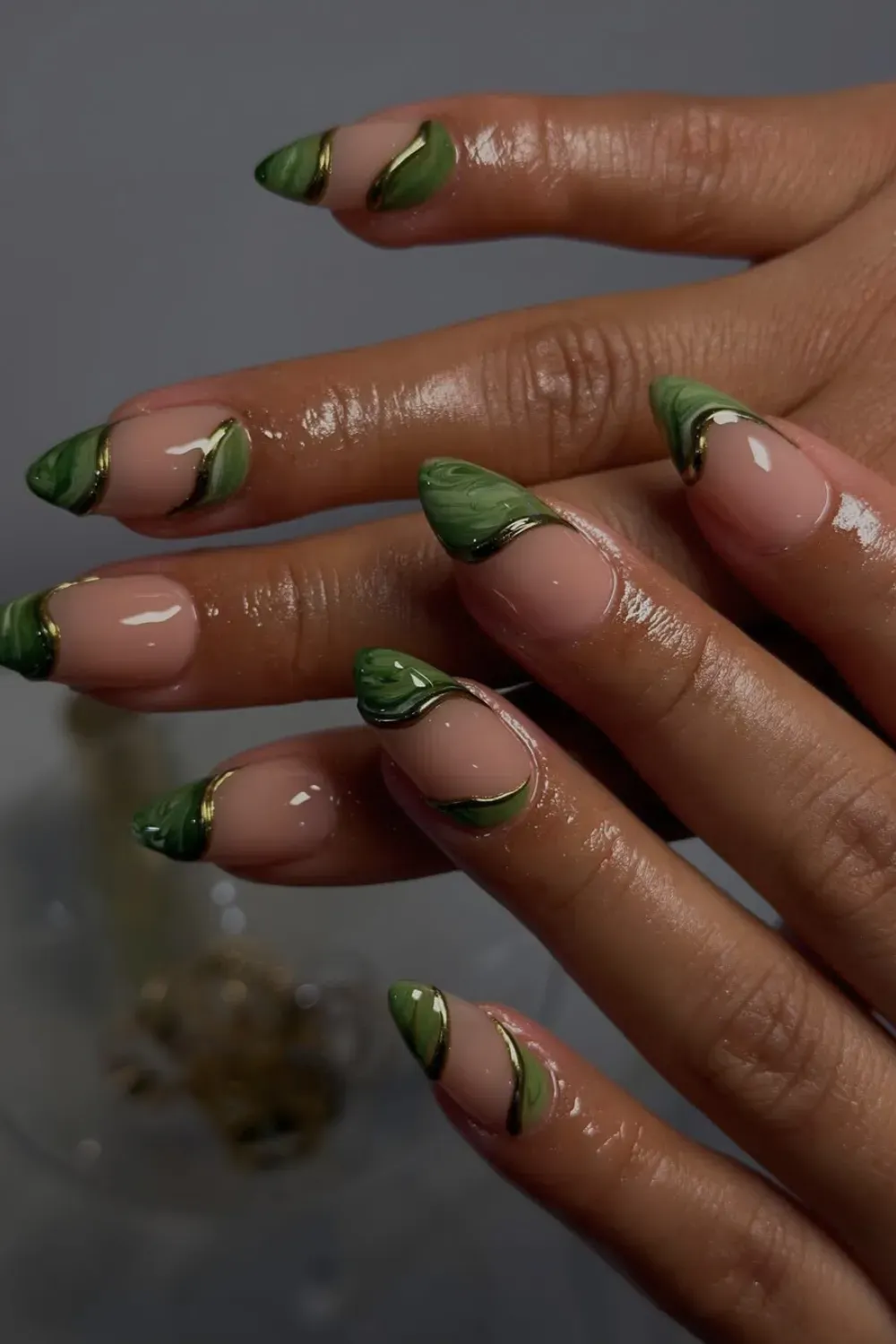 Green Marble Chrome Nails Alt Text: Green marble french tips with gold chrome abstract outline.
