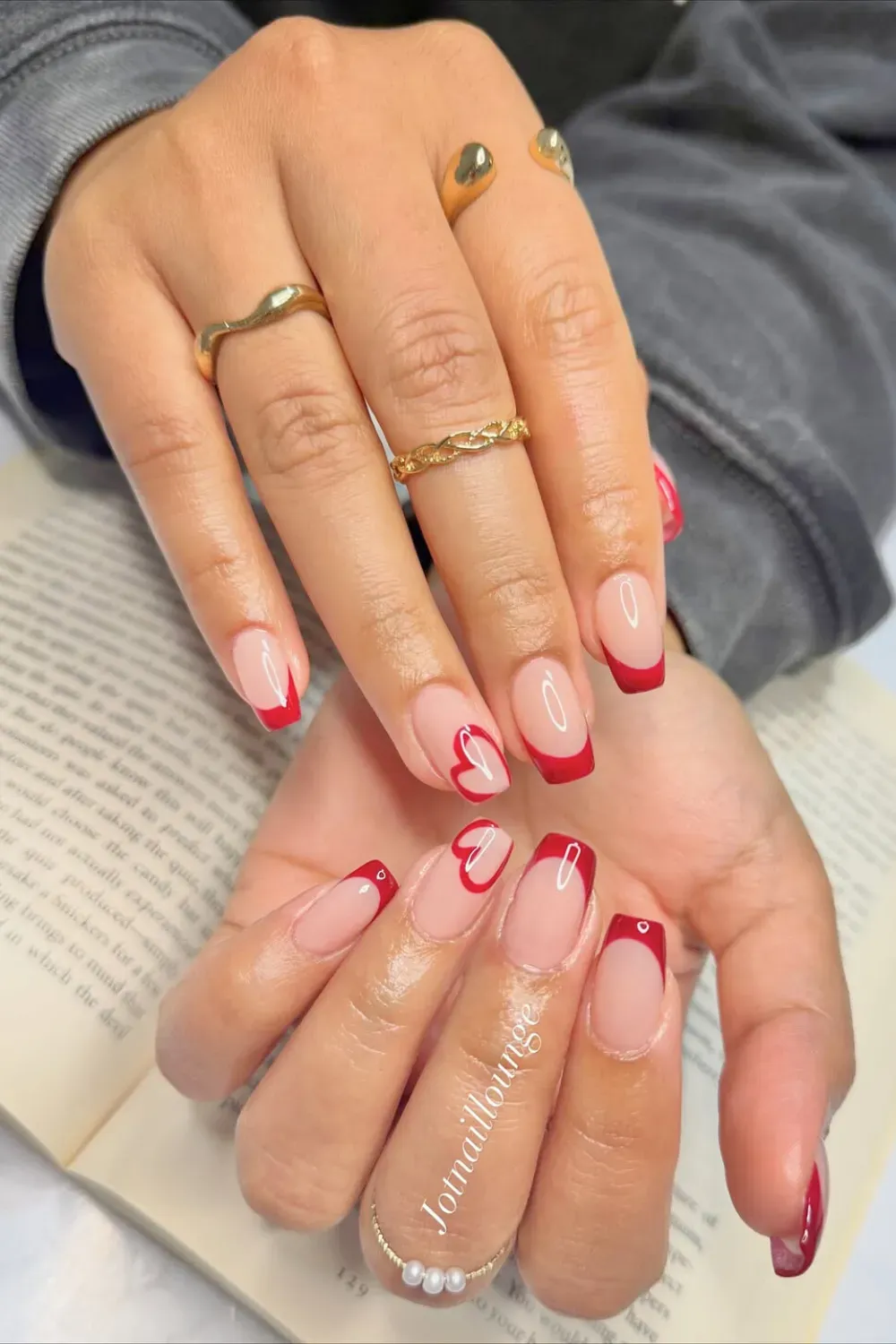 Heartfelt Red Square French: Square nails with vibrant red French tips, one featuring a delicate heart design