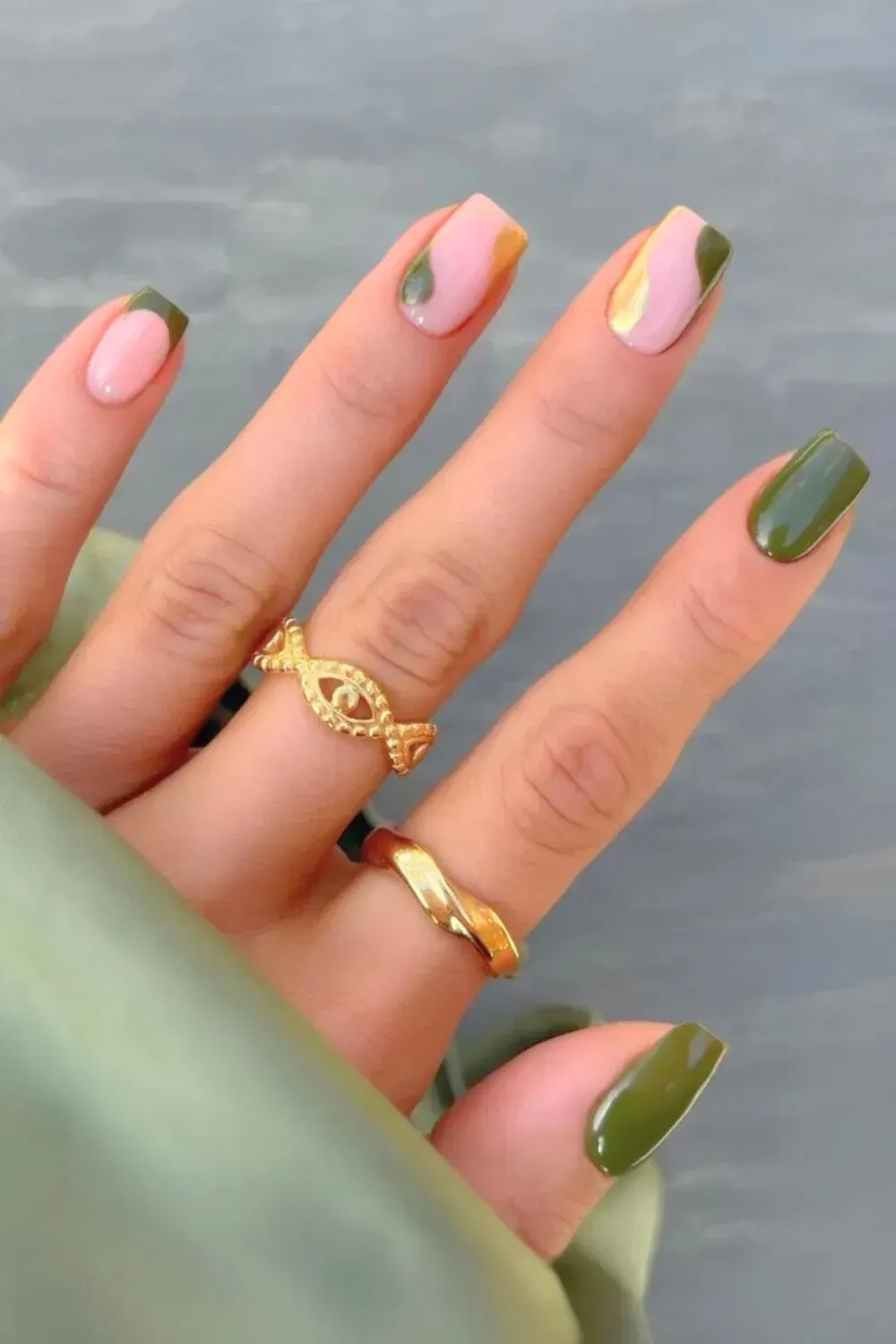 Olive Green Swirl and Gold Abstract Nails - Medium square nails with glossy olive green, pink, and gold abstract swirl art over negative space.