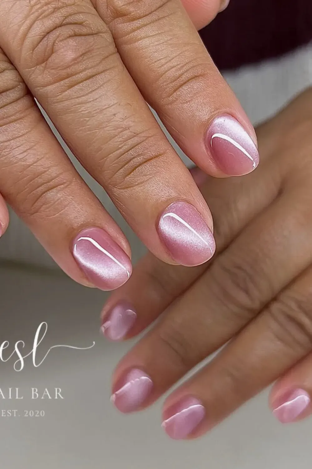 Soft delicate baby pink velvet finish cat eye nails on short lengt