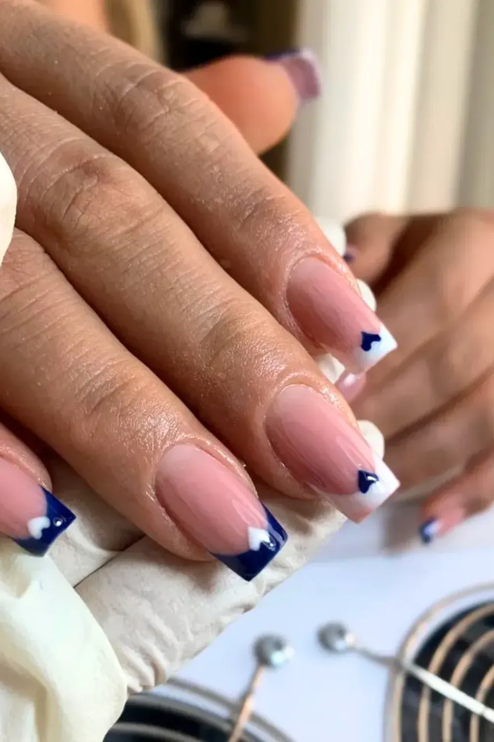 Blue Heart Square French: Square French tip nails featuring a blue tip and sweet heart details.