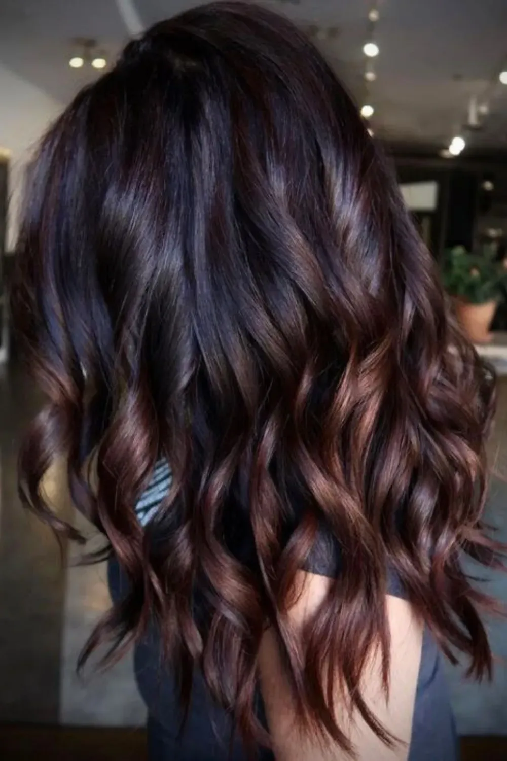 Dark Chocolate with Moody Cherry-Caramel Ends	Back view of medium-length dark hair with deep, subtle cherry-caramel undertones and a high-gloss finish.