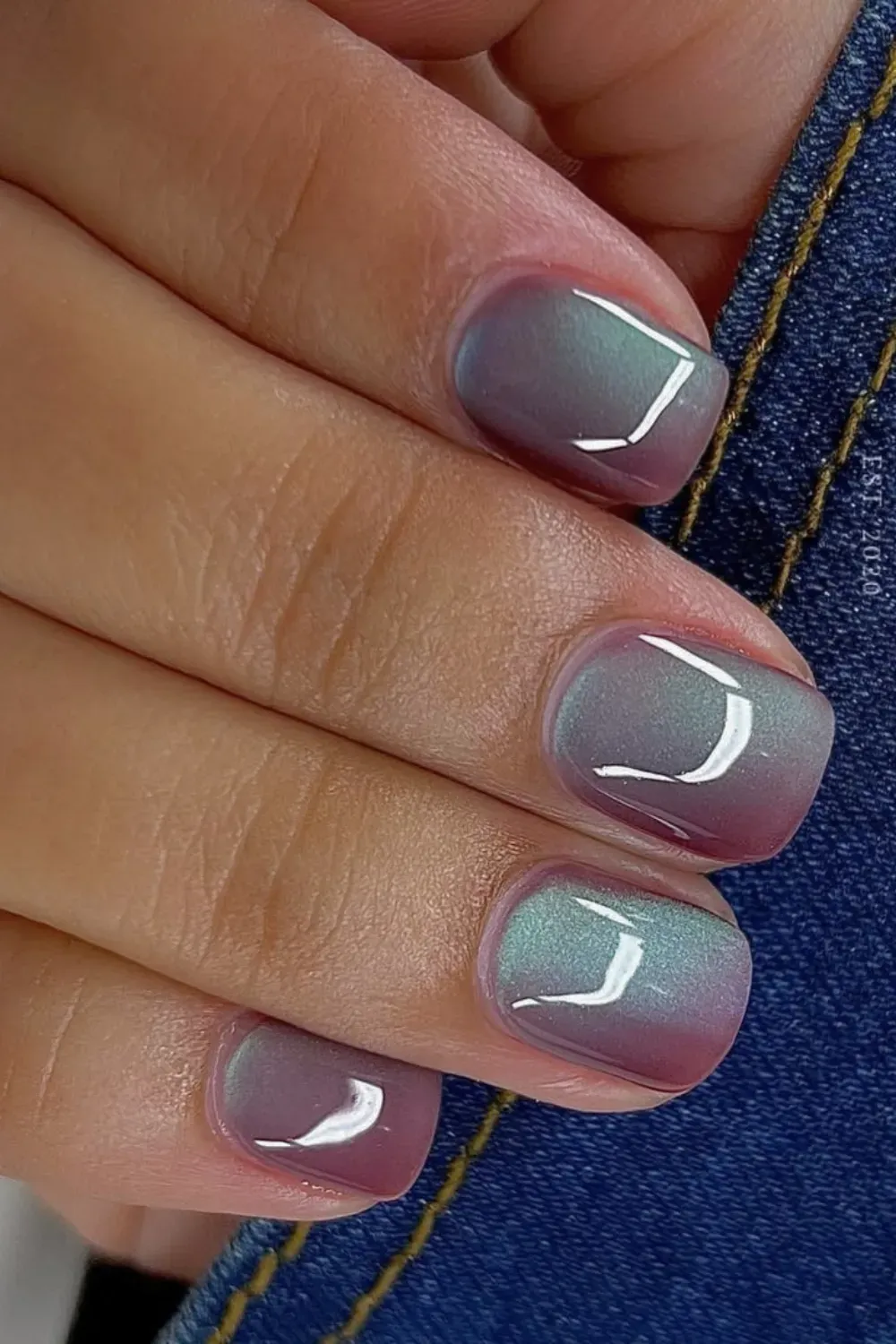 Short square nails with muted purple and green duochrome magnetic polish