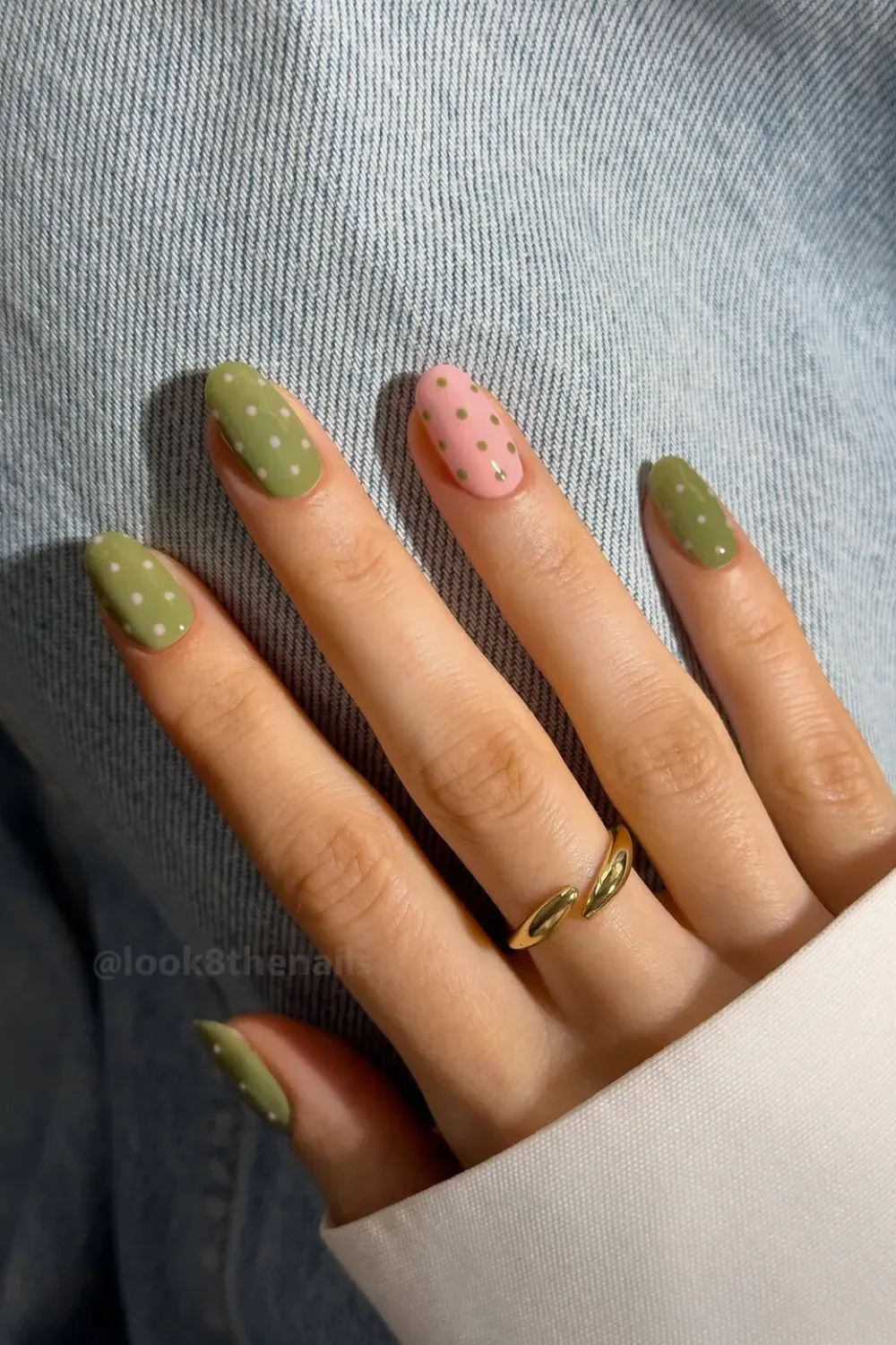 Matcha Green and Pink Polka Dot Manicure - Short squoval nails painted dusty matcha green and light pink with subtle pink polka dots.