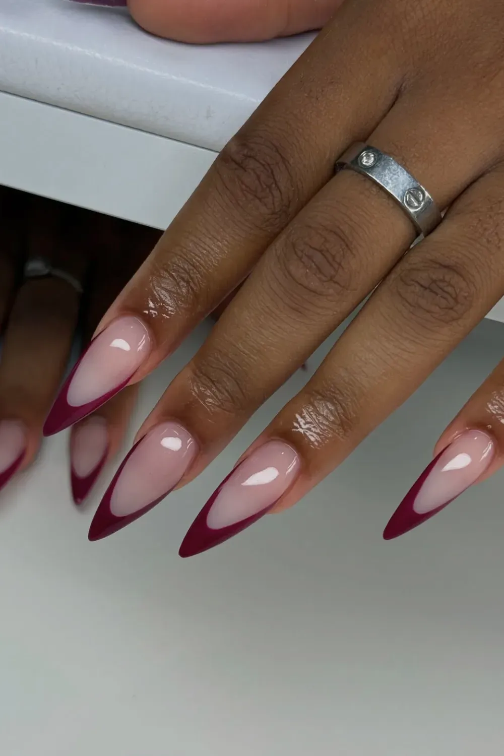 Deep Maroon Stiletto French: Dramatic stiletto nails with a glossy deep maroon French tip