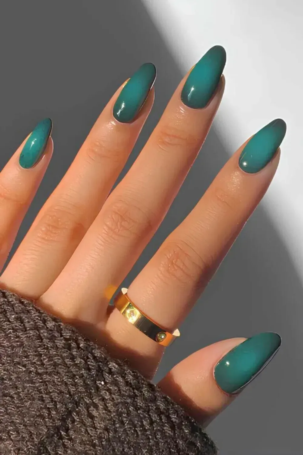 Bold Teal Aura Gradient Stiletto Nails - Long stiletto nails with a glossy dark green to vibrant teal airbrushed aura gradient effect.