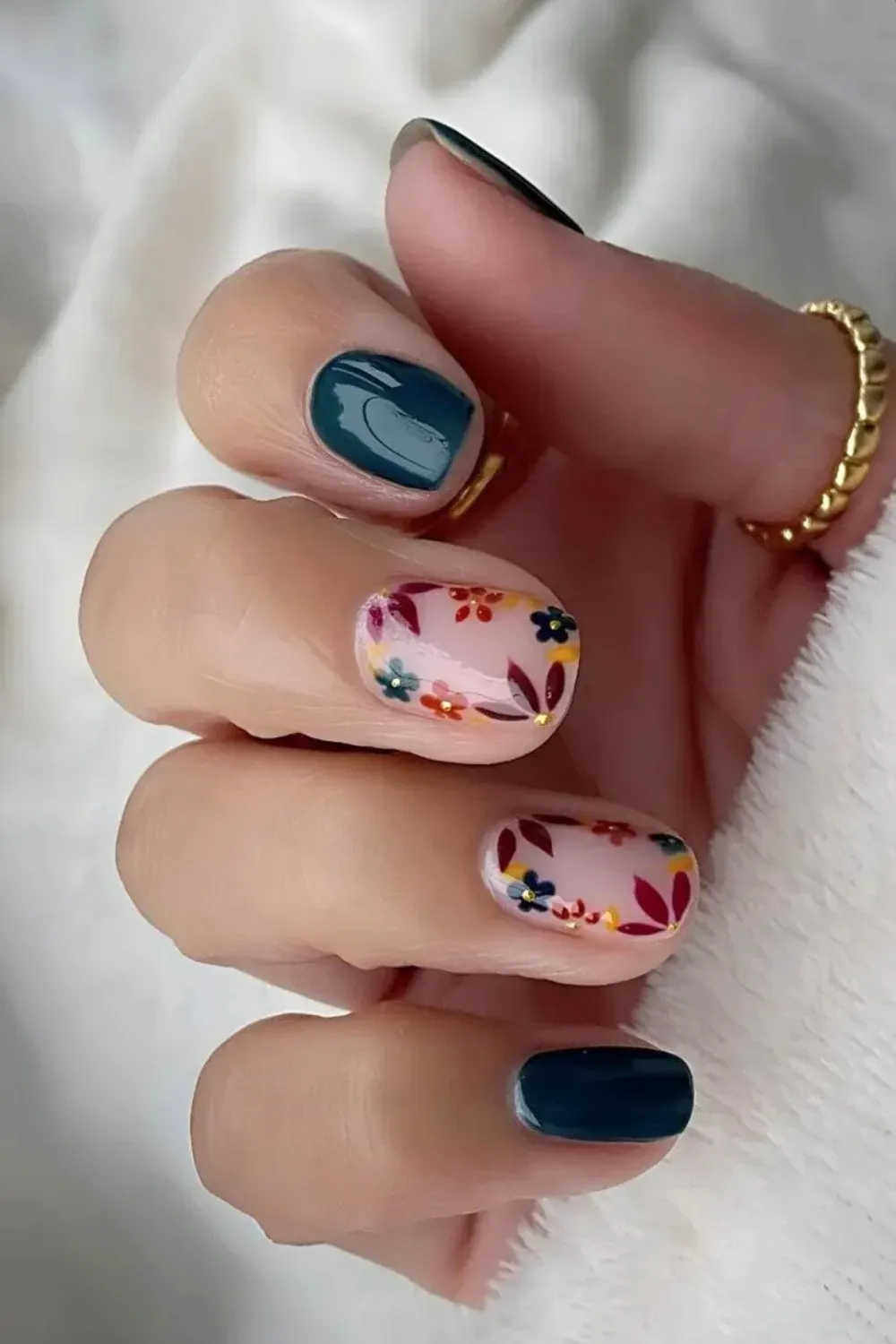 Dark Forest Green Nails with Autumnal Floral Art - Short squoval nails featuring solid dark forest green and neutral nails with miniature autumn floral art.