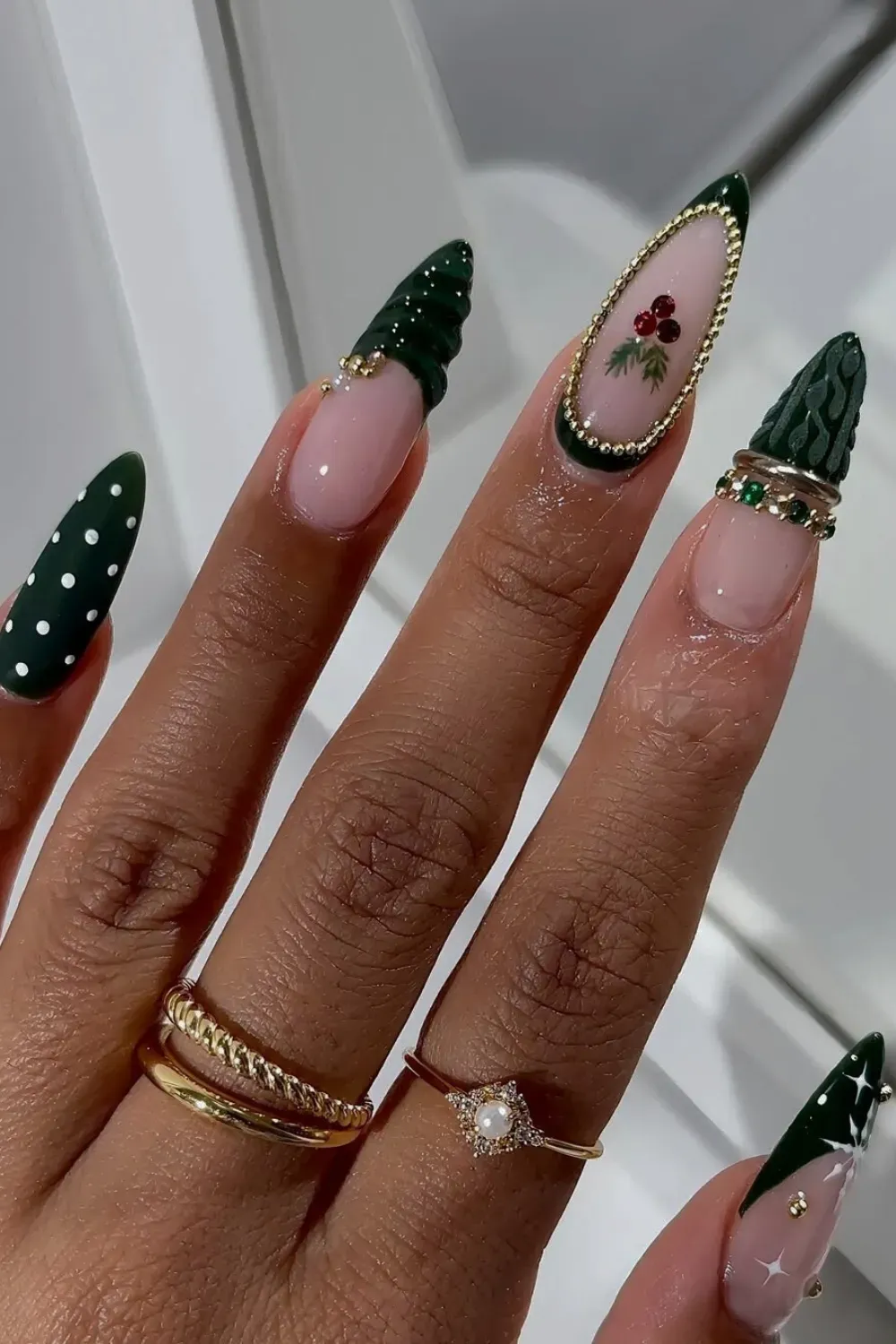 Festive Bangle Nails: 3D Chrome and Sweater Knit Holiday Art - A luxurious 3D gold Bangle Nail design with emerald green sweater knit texture and holiday holly accents on long stiletto nails.