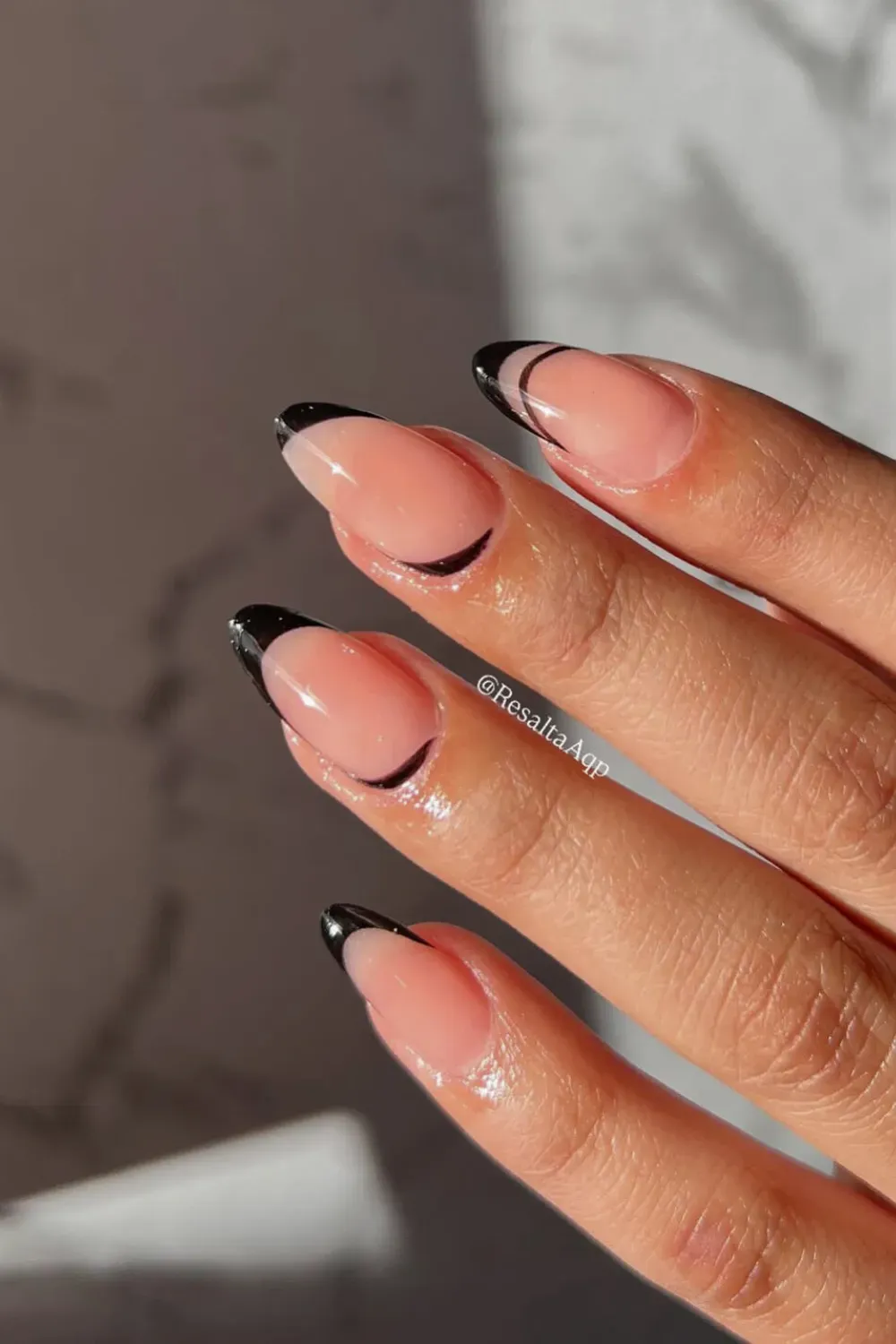 Double Line Black French: Almond nails with a minimalist yet striking black double-line French ti