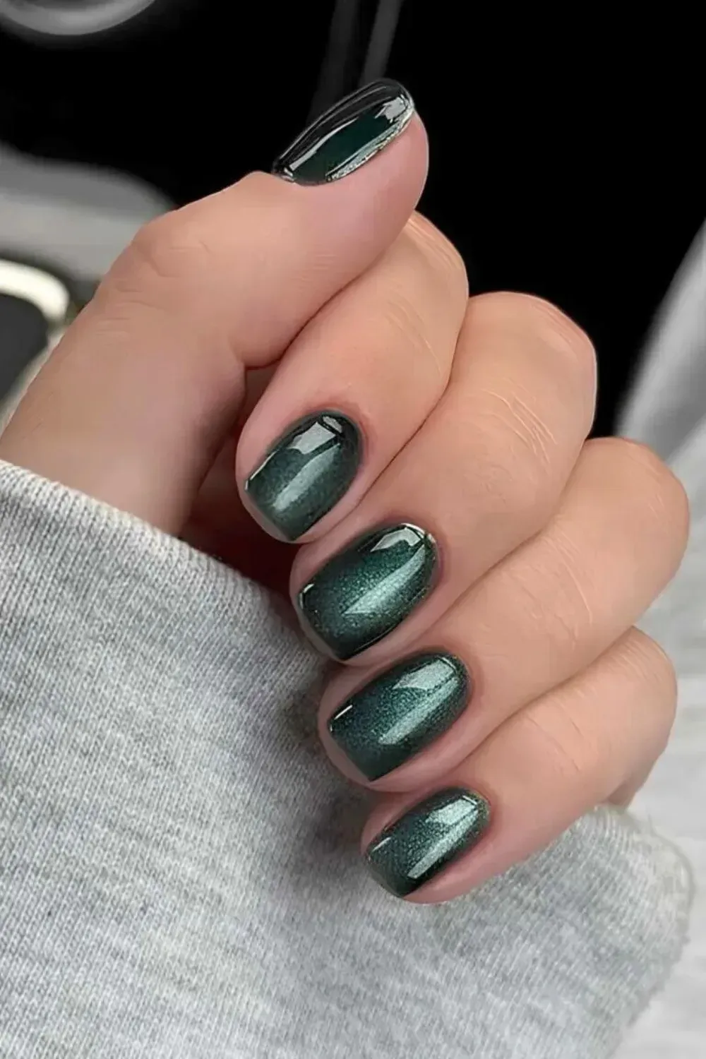 Short Dark Teal Green Cat-Eye Manicure - Short squoval nails featuring a shimmering, dimensional dark teal green magnetic cat-eye effect.