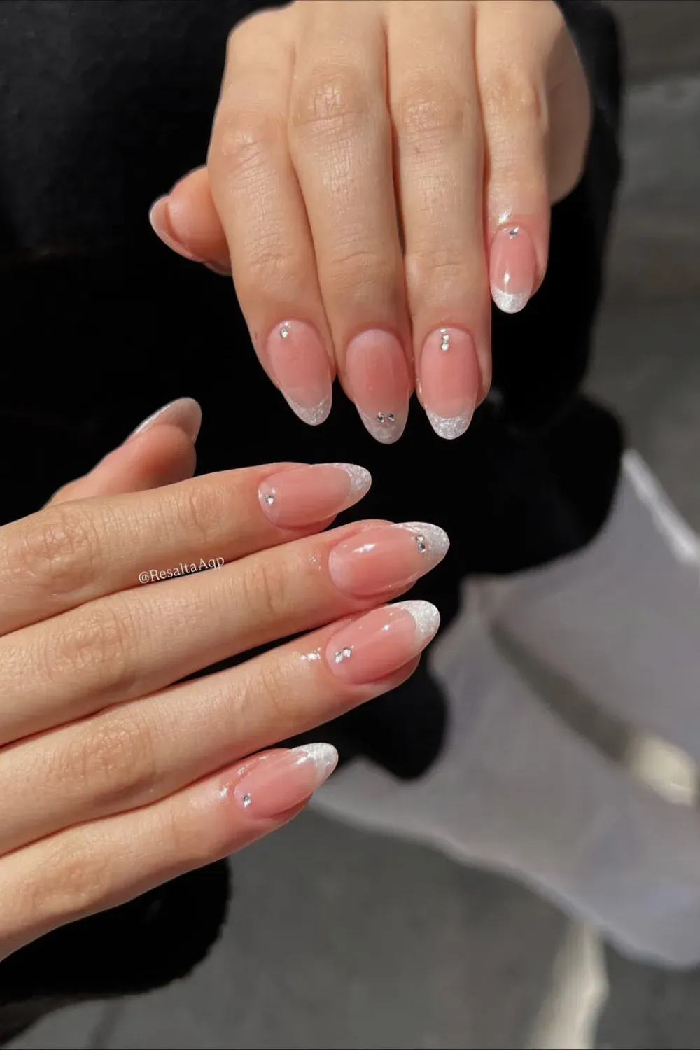 Sparkle White Oval French: Oval nails featuring a shimmery white French tip and delicate rhinestones