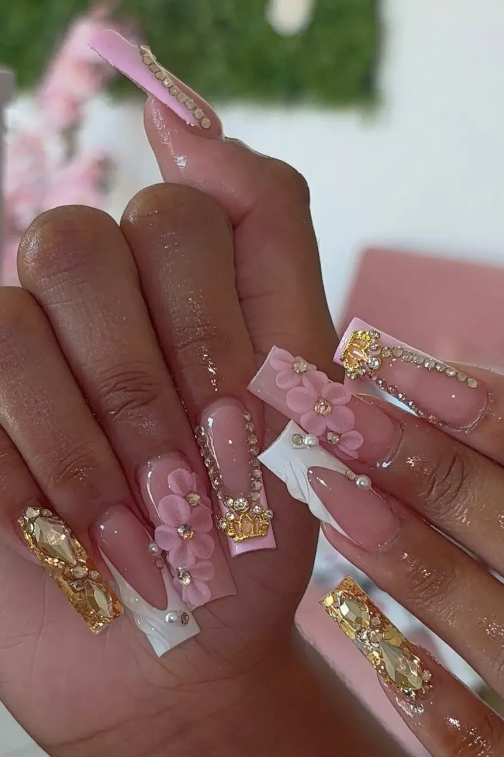 Princess Pink 3D Nails Alt Text: Pink french nails with 3D flowers and gold crown charm.