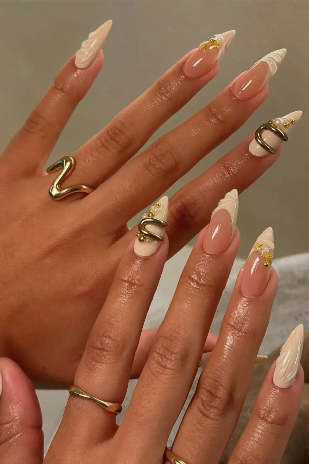 Nautical Gold Charm Nails Alt Text: Cream french tips with 3D shell texture and gold anchor charms.