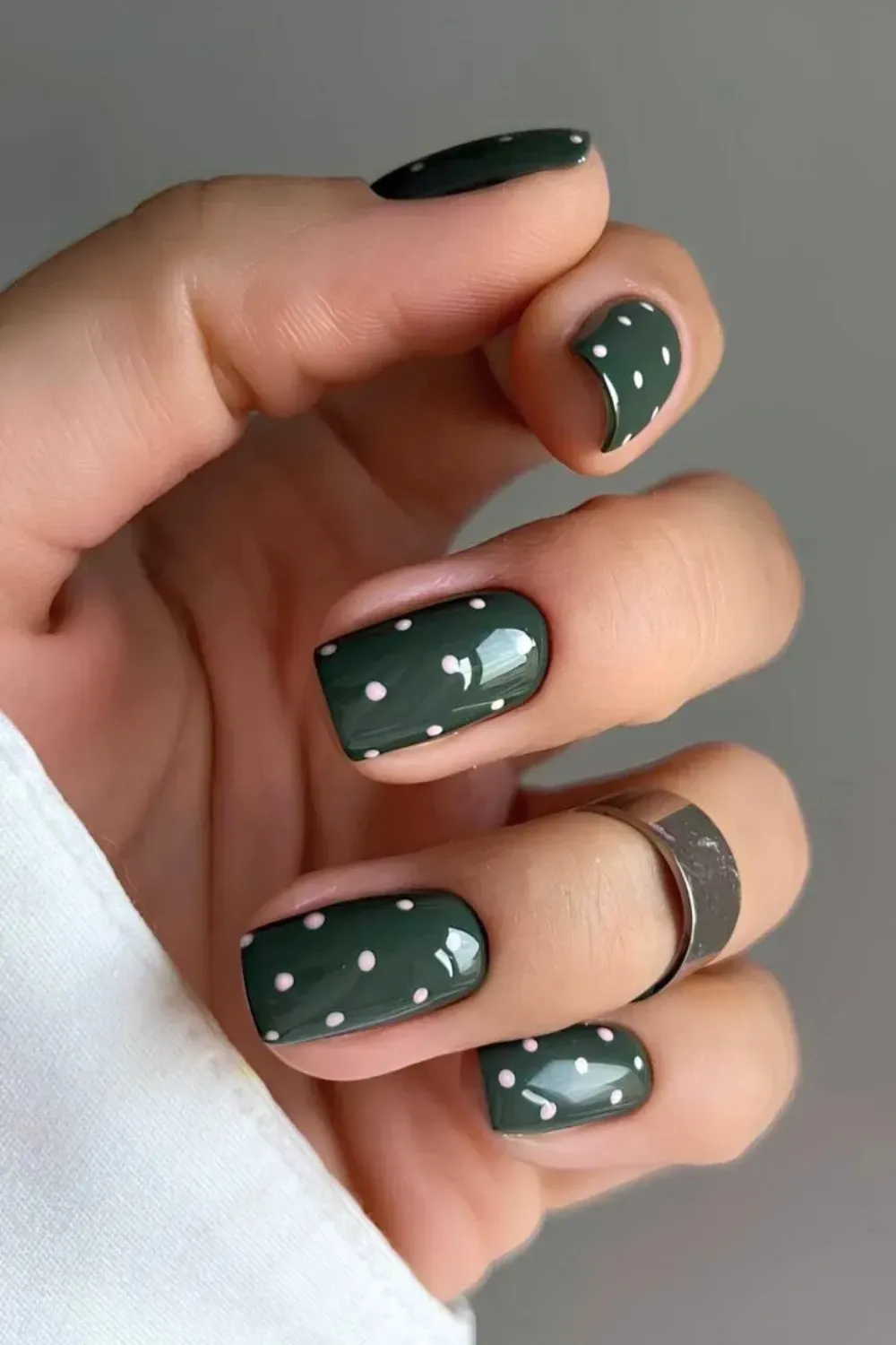 Dark Hunter Green Polka Dot Nails - Medium square nails painted solid dark hunter green with small white/pink polka dots.