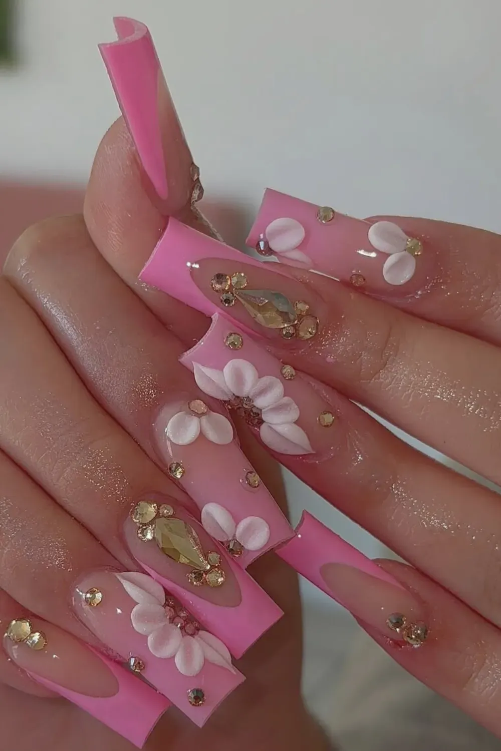 Pink Floral French Nails Alt Text: Pink french tips with large 3D white and pink flower petals.
