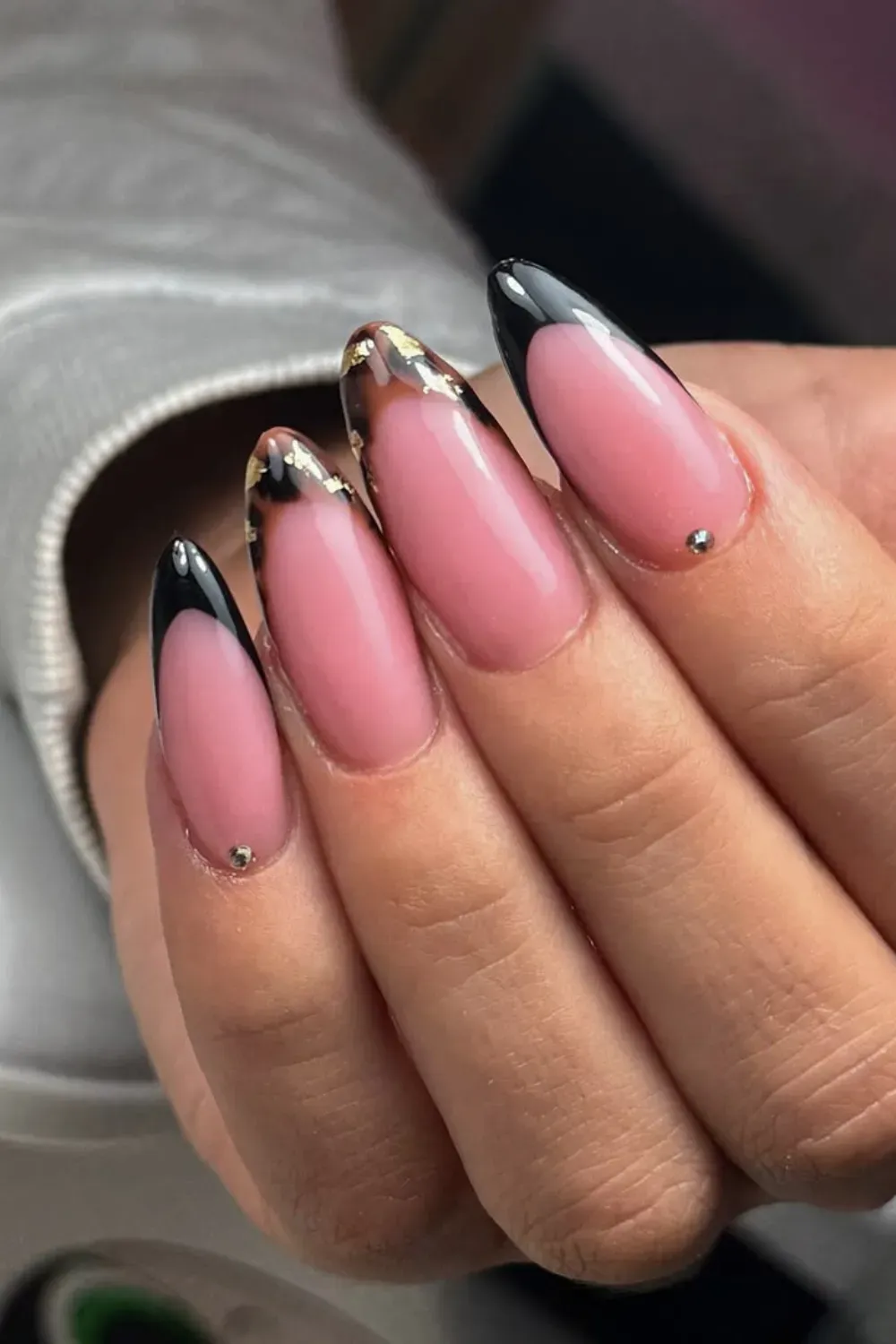 Chic Tortoiseshell Pointed French: Pointed nails with black and tortoiseshell French tips and minimalist studs.