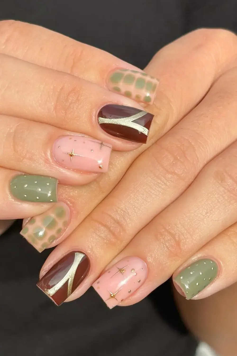 Autumnal Khaki and Chocolate Brown Nail Mix - Short square nails with a mix of khaki green, chocolate brown, and pink with gold star decals and checkered print.