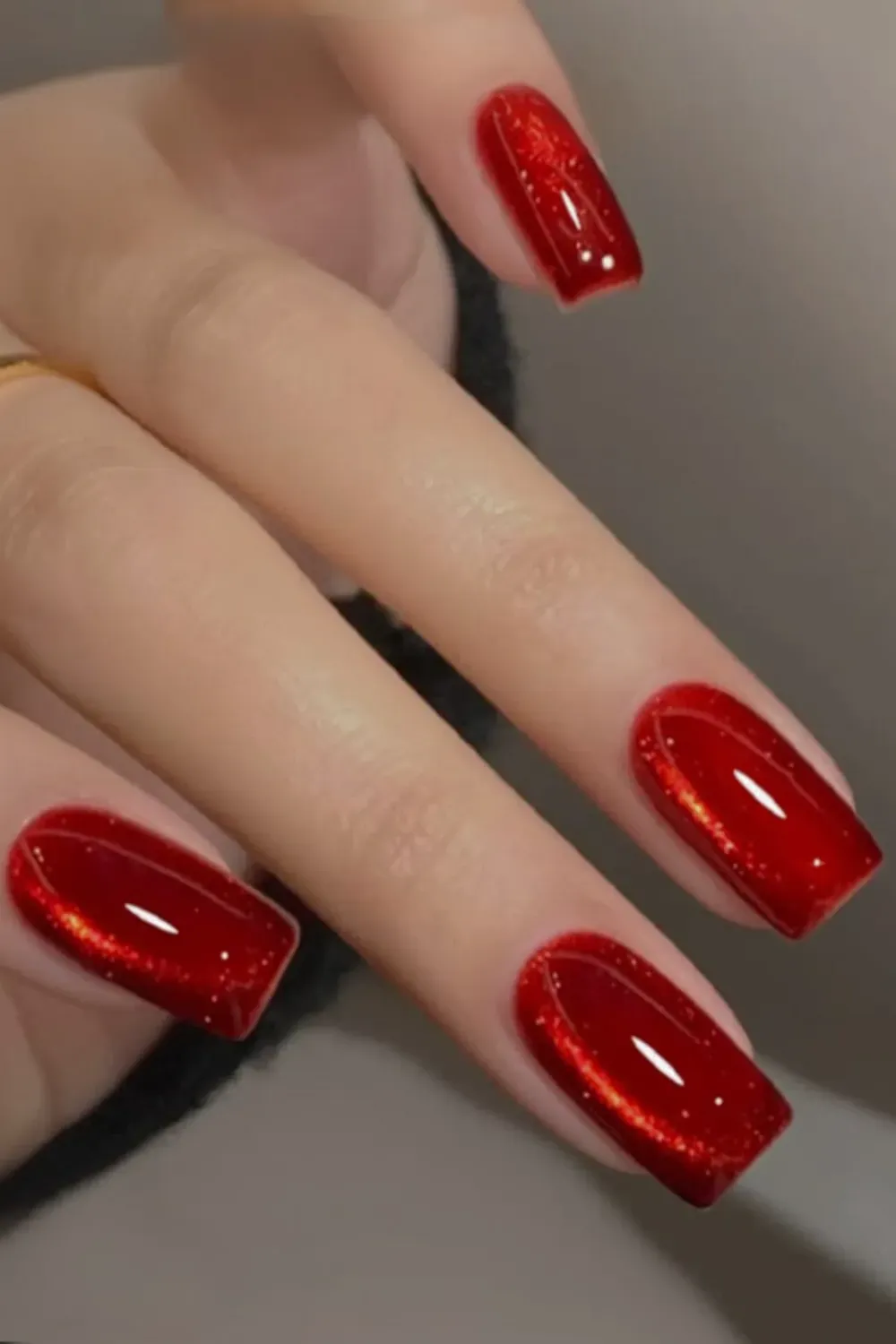 Bright vibrant ruby red cat eye nails with a strong magnetic line.