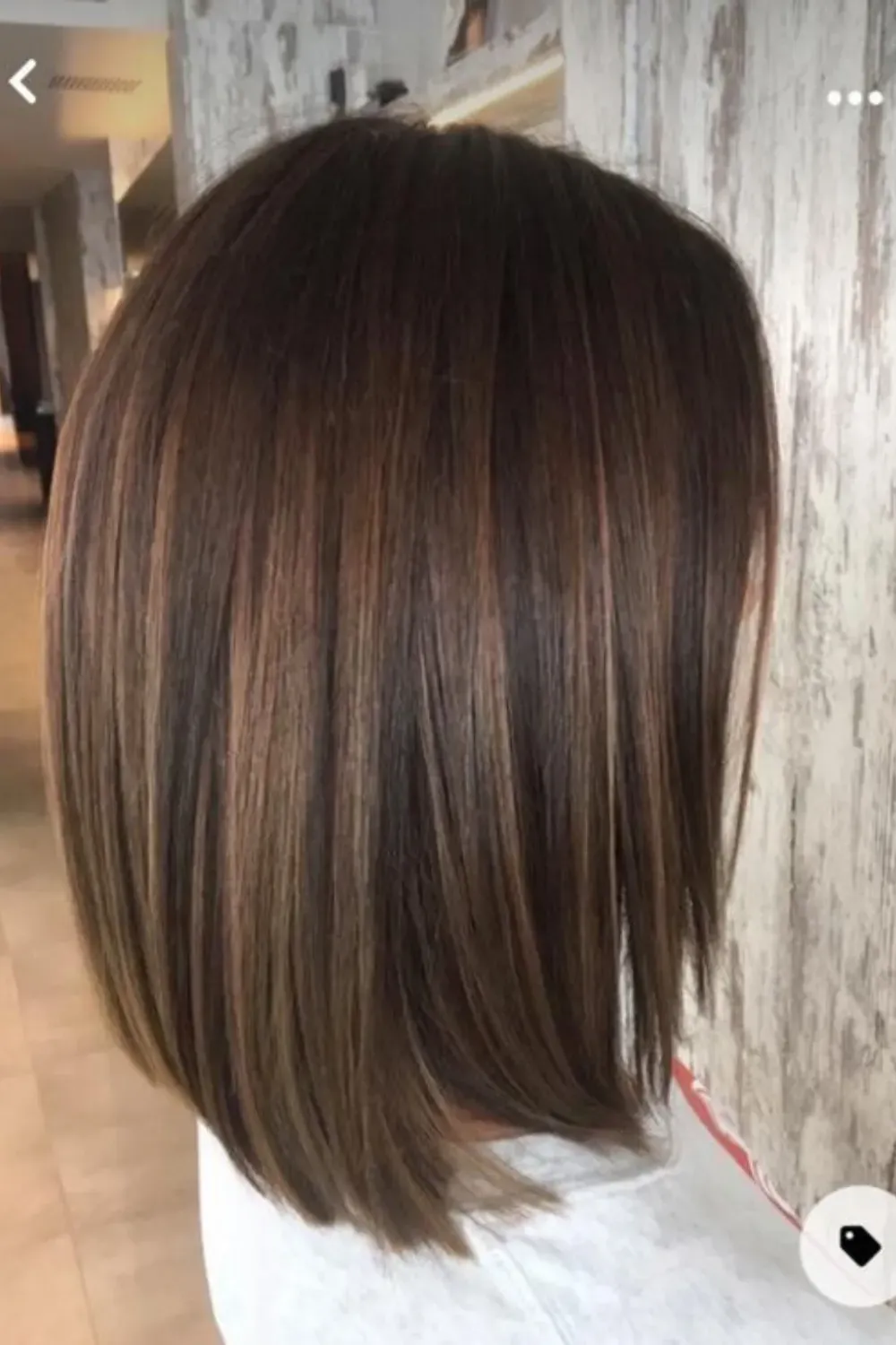 Fine Weave Caramel Highlights on Straight Lob	Side view of a dark brown straight lob with delicate, subtle caramel highlights throughout.