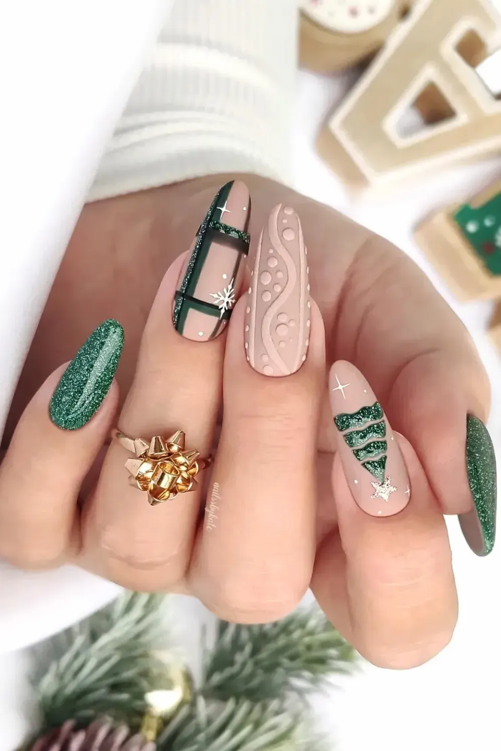Green Plaid and Cable Knit Almond Nails - Almond nails featuring green glitter Christmas tree, plaid pattern, and cable knit texture.