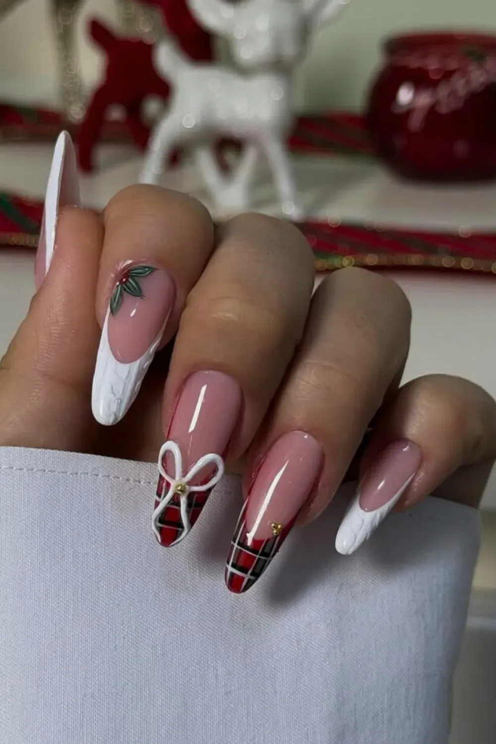Plaid and 3D Bow Stiletto Nails with Knit Texture - Stiletto nails with a mix of red plaid, a white knit texture, and a 3D white bow.
