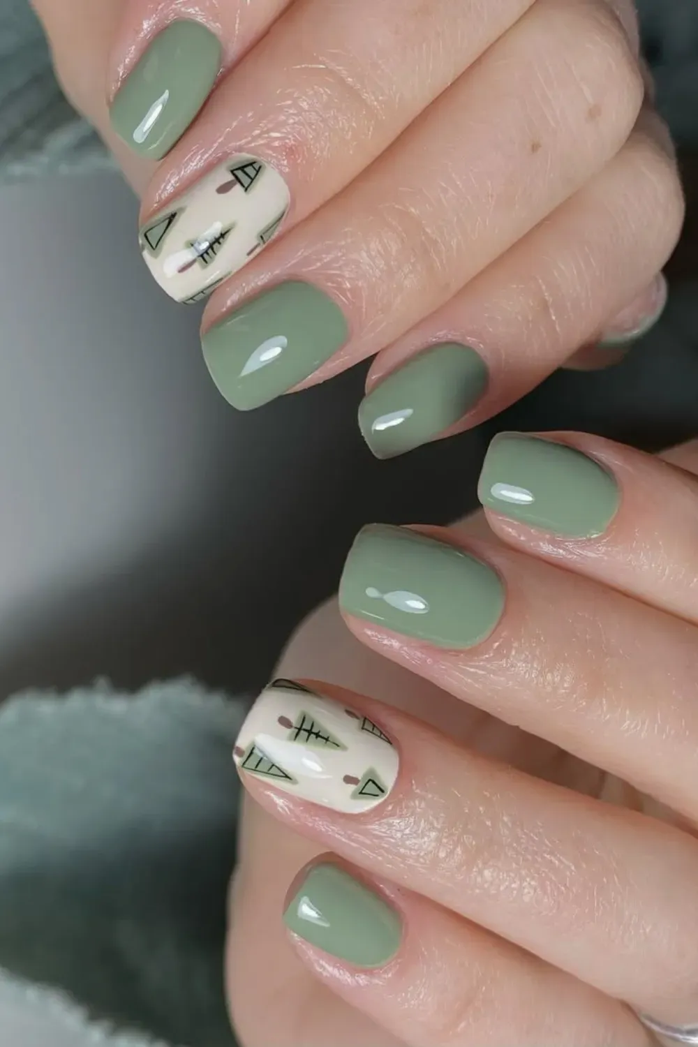 Sage Green Nails with Minimalist Trees - Short square sage green nails with minimalist hand-drawn Christmas trees on accent nails