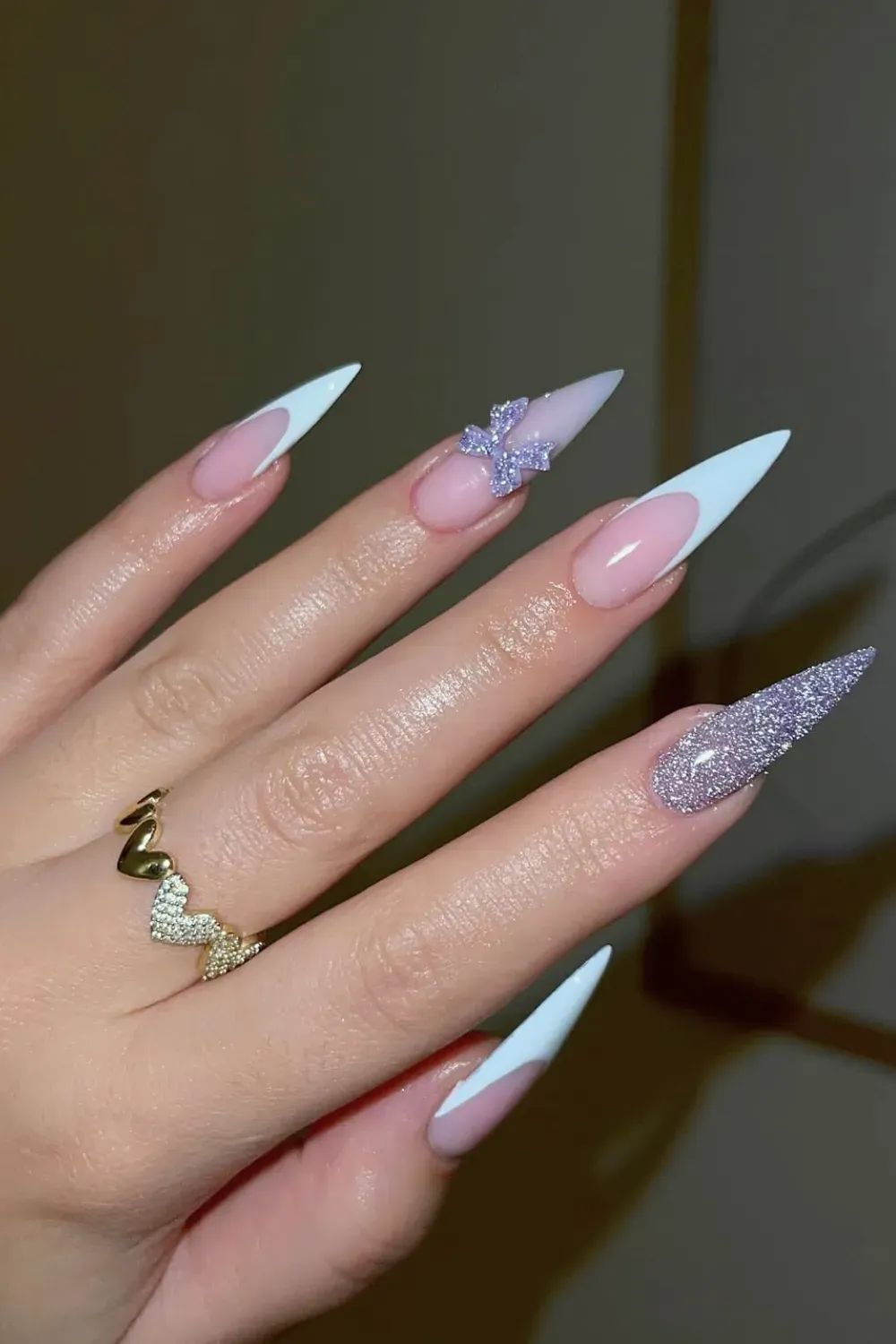Purple Glitter Bow Stiletto Nails - Stiletto nails with white French tips and a sparkling purple glitter bow accent