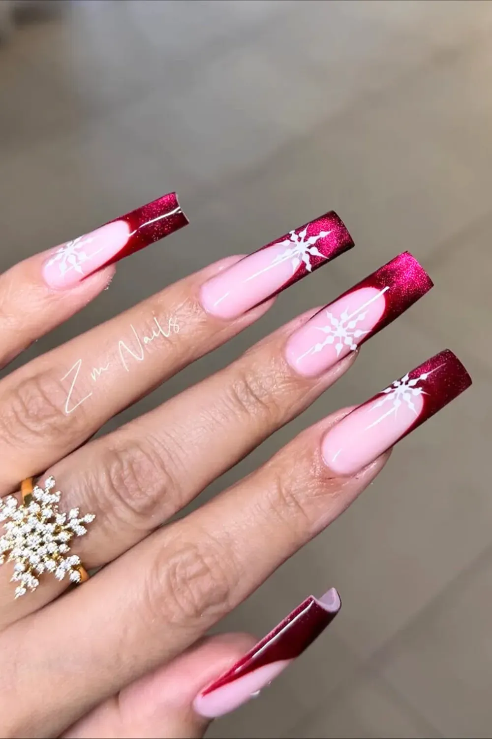 Red Glitter French Nails with Snowflakes - Long coffin nails with sparkling red glitter French tips and large white snowflakes.