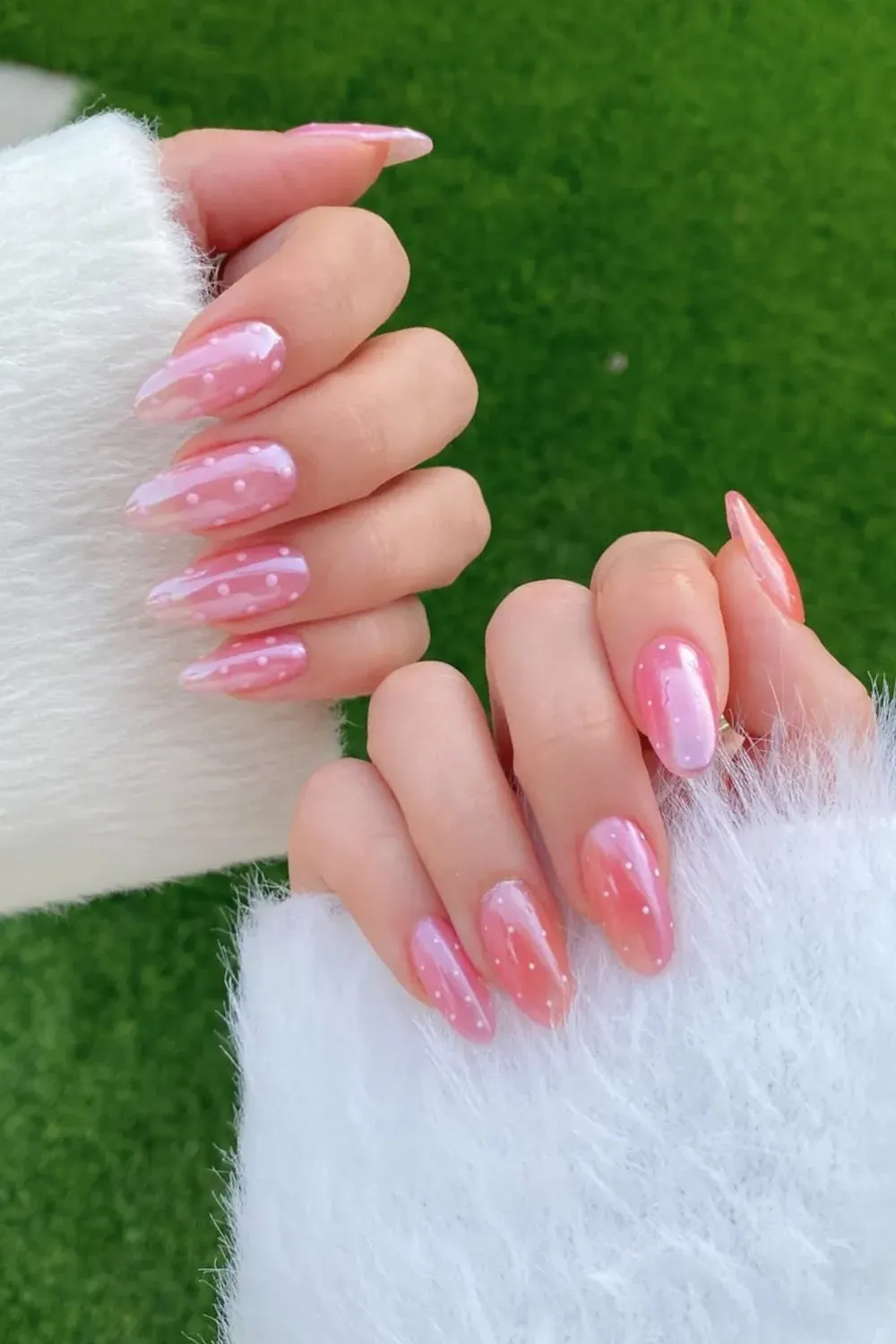 Iridescent Polka Dot Dream - Long almond pink nails with iridescent finish and white polka dots winter design.