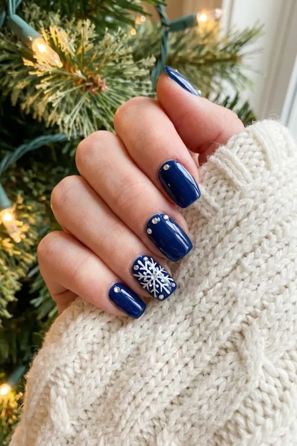 Royal Navy Rhinestone Snowflakes - square dark glossy navy nails with white hand painted snowflakes and rhinestones