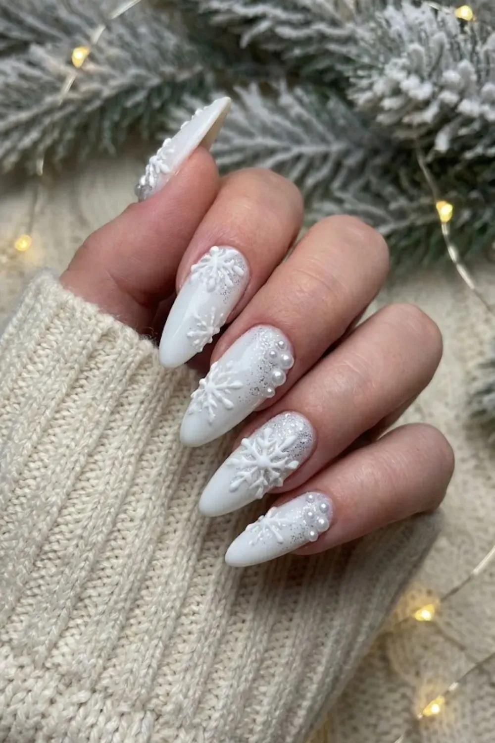 Textured White Sweater Nails with Snowflakes - White winter manicure featuring 3D cable knit sweater texture, sugary glitter, and snowflakes.