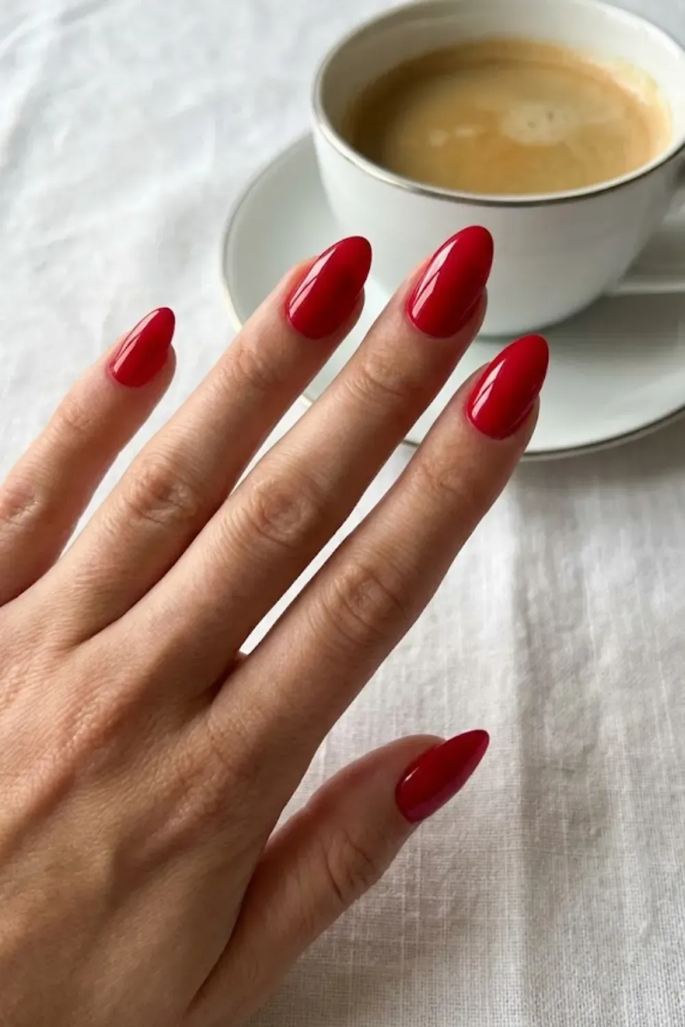 Classic Cherry Red – Bright red gel nails almond shape timeless manicure