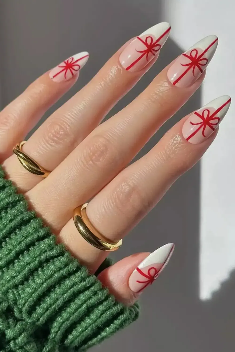 White Nails with Red Gift Ribbon Art - Almond nails with a milky white base and red hand-painted gift ribbon and bow designs.