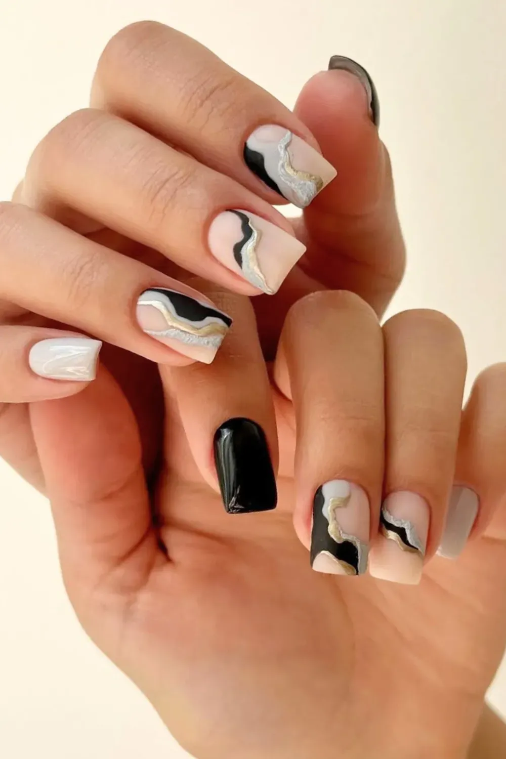 Minimalist Abstract Swirls	Square nails with black, white and silver abstract swirls