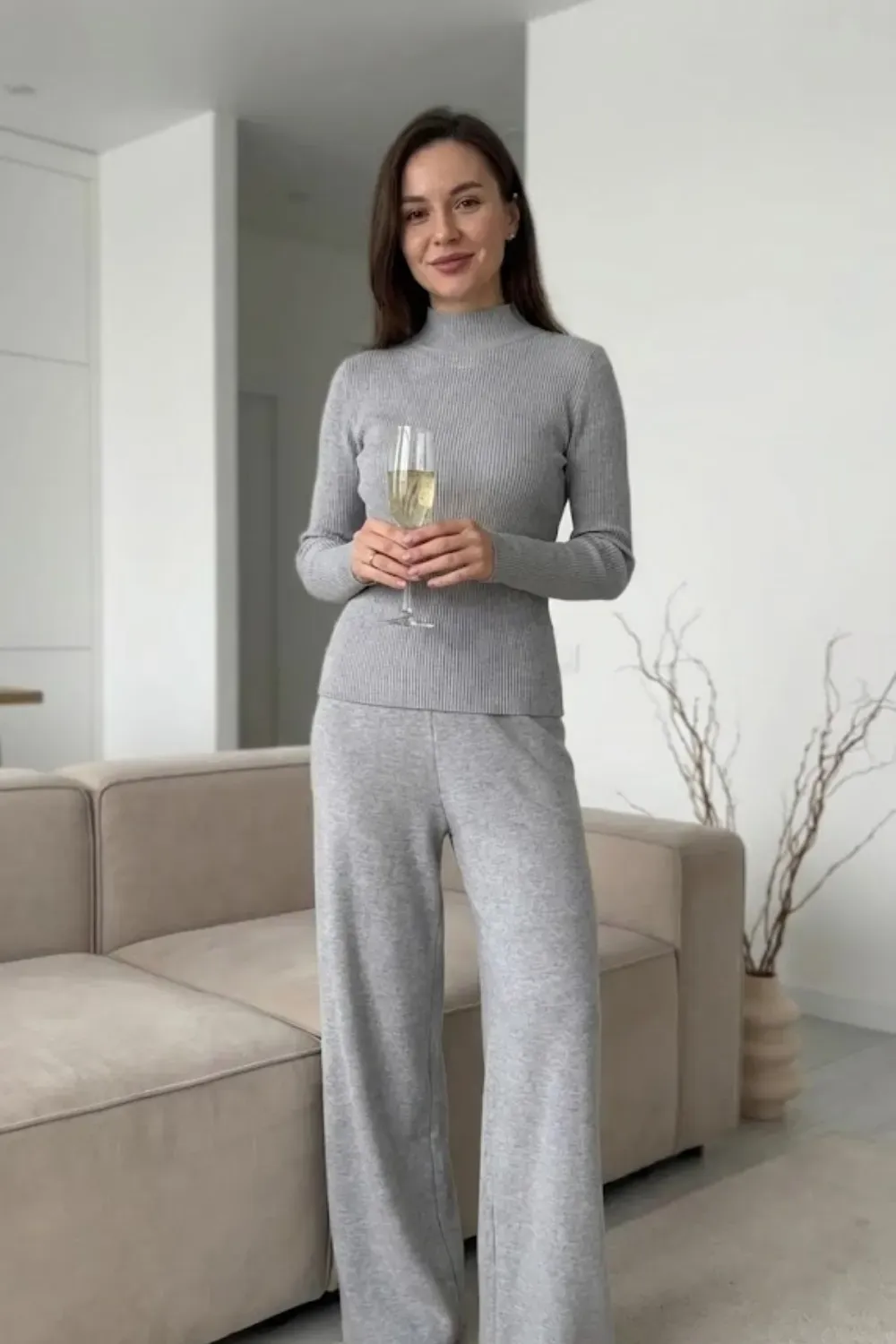 Matching Grey Knit Lounge Set – Relaxed luxury look featuring a matching grey ribbed knit top and wide-leg pants set.